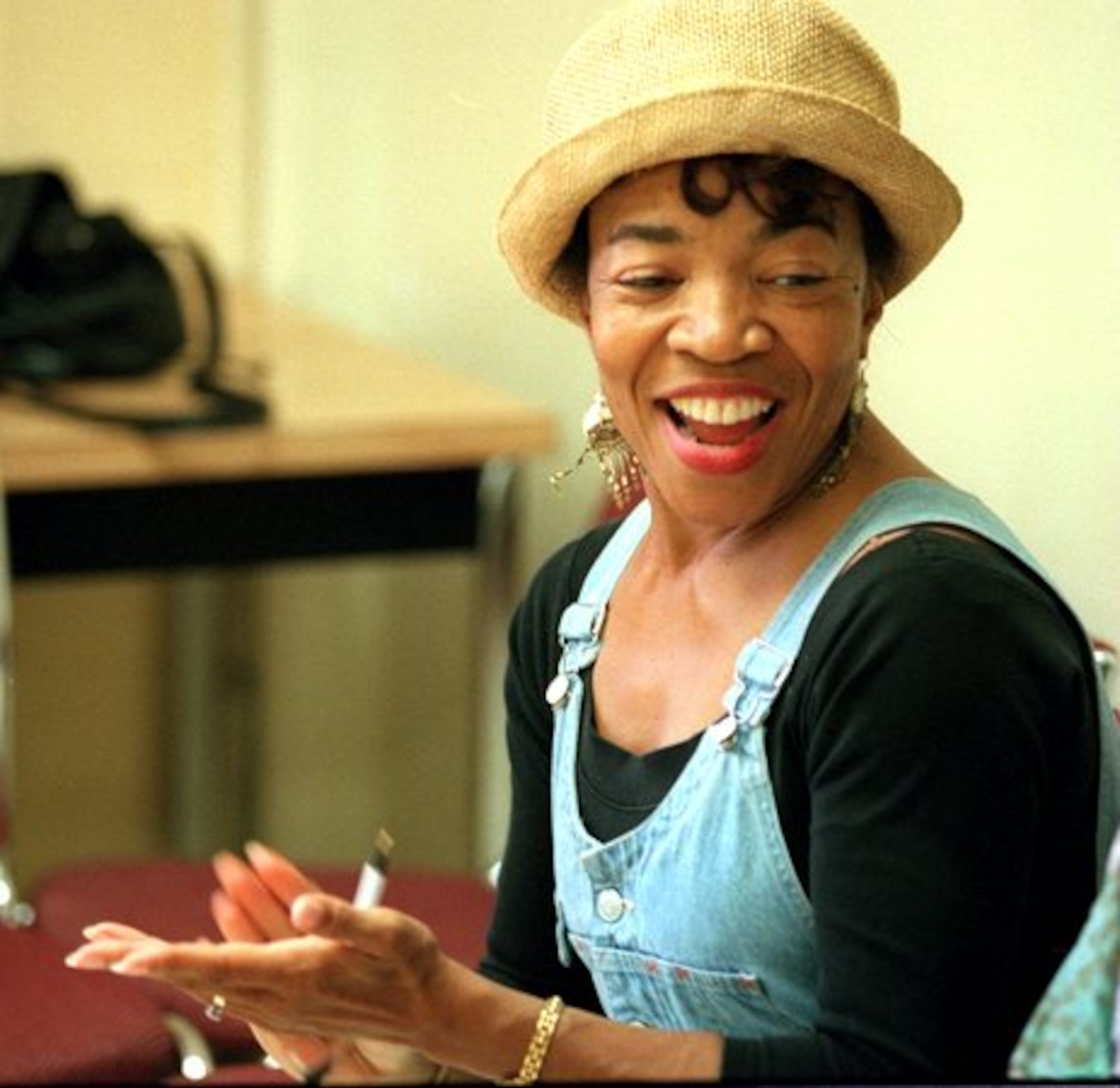 Instructor Carol Mitchell-Leon shows her approval as 9-to 13 year-old students in the Atlanta Street Theater ensemble rehearse in Clark Atlanta University.