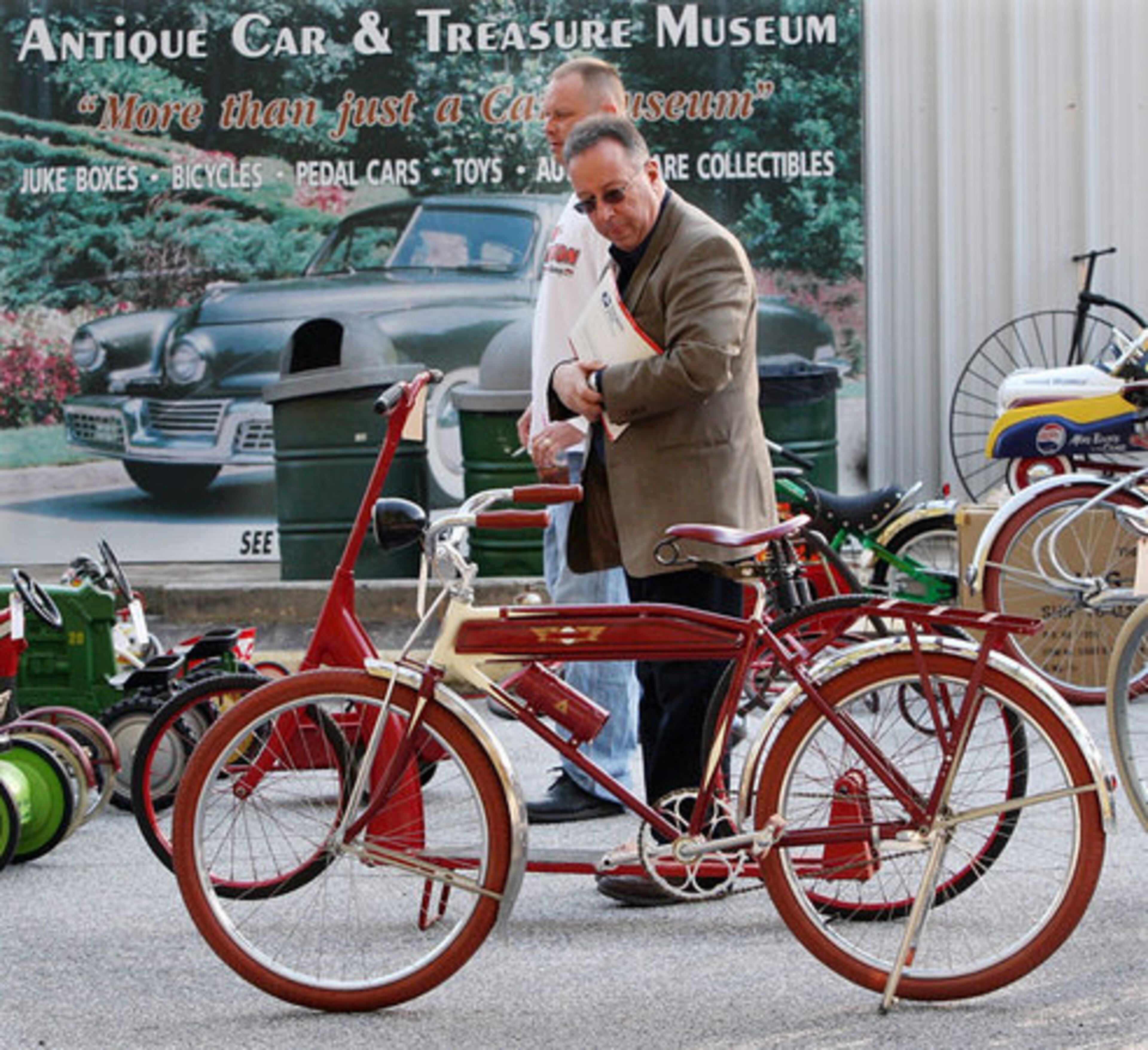 Anthony Ballato, of Long Island, N.Y., checks out some antique bicycles.