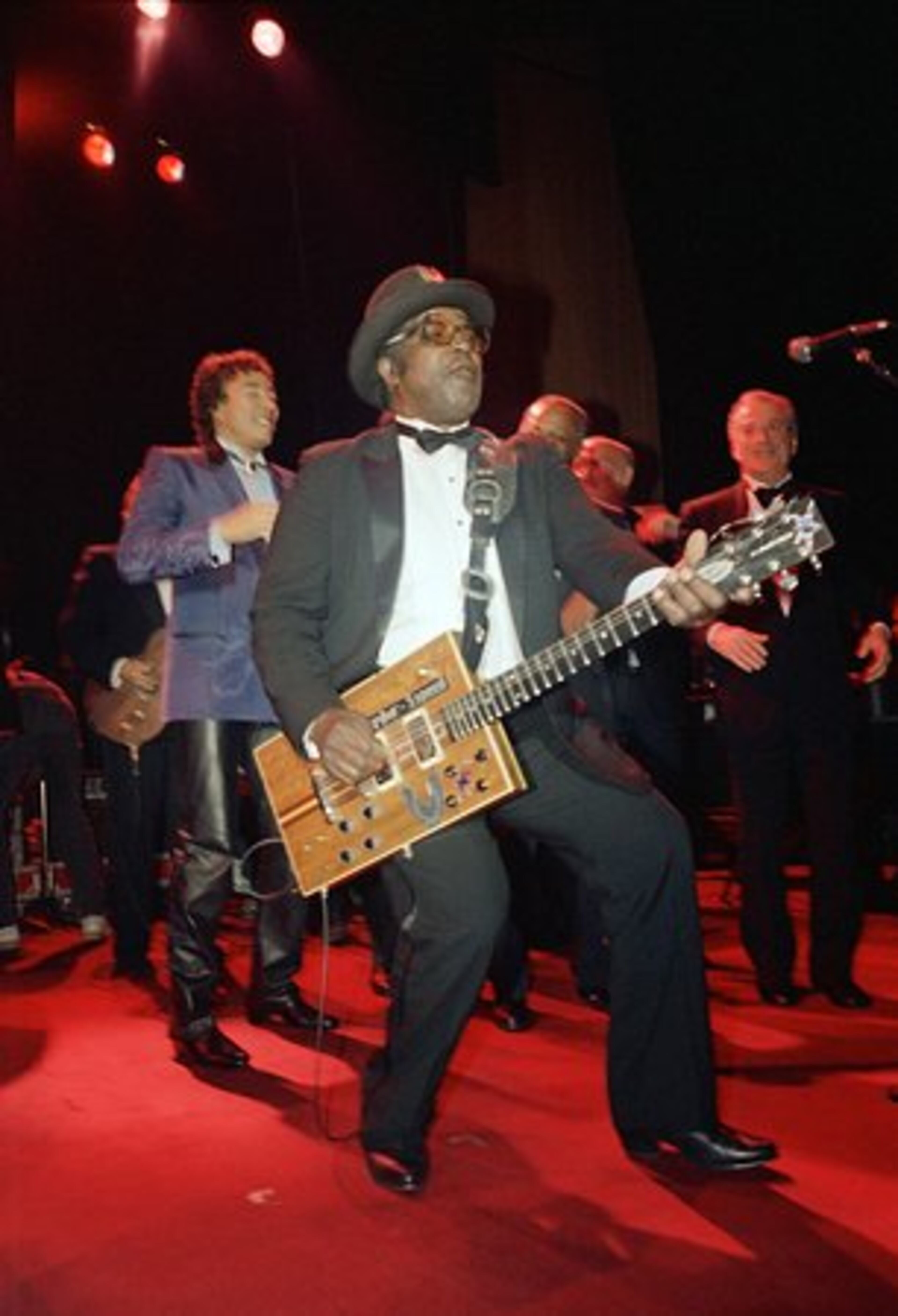 Never one to miss a stage, Diddley happily rocked out with other 1987 inductees (that's Smokey Robinson at left) at the Rock and Roll Hall of Fame ceremony in NY.