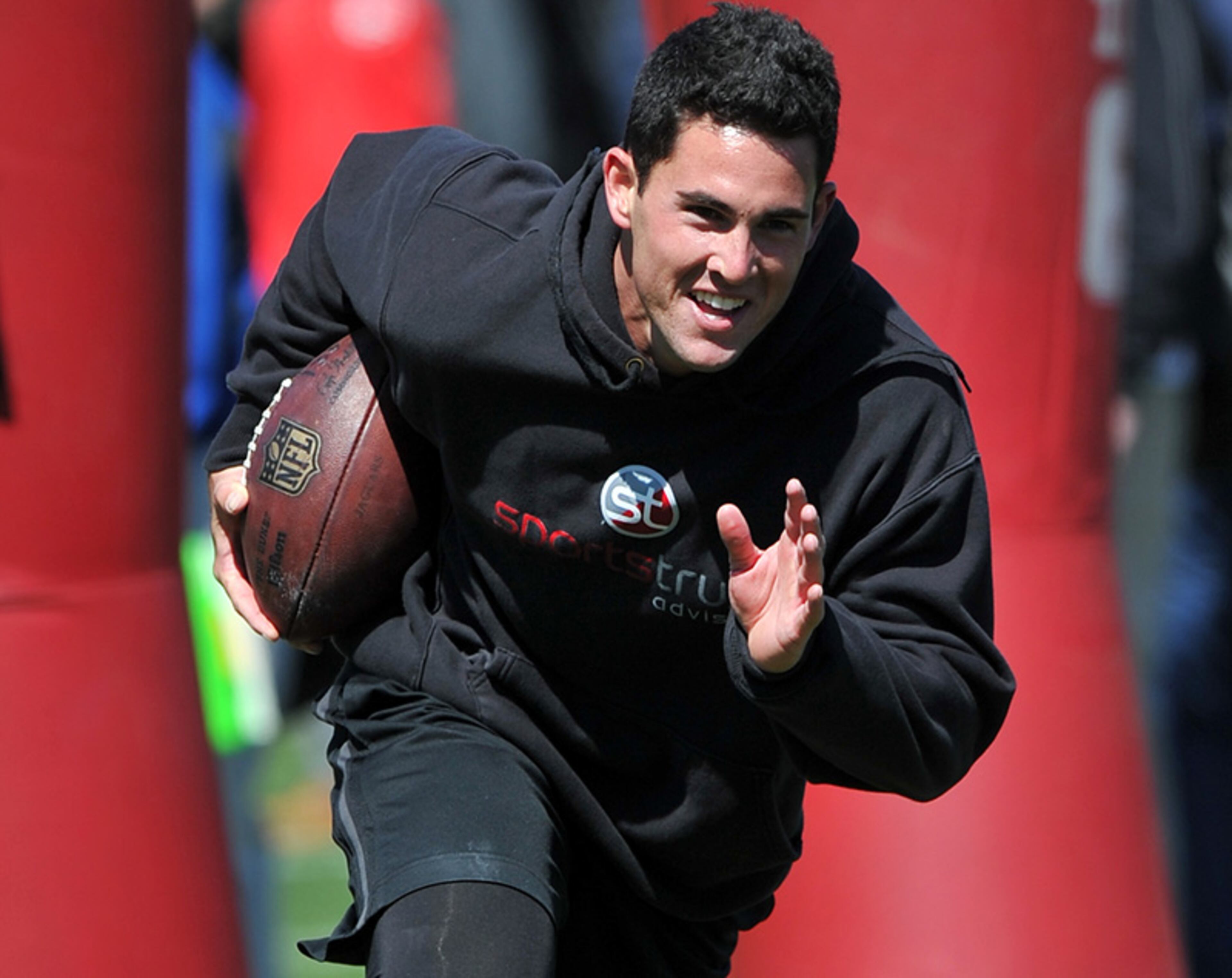 Former Georgia quarterback Aaron Murray warms-up before working out in front of NFL scouts during Georgia's Pro Day Wednesday April 16, 2014, in Athens.