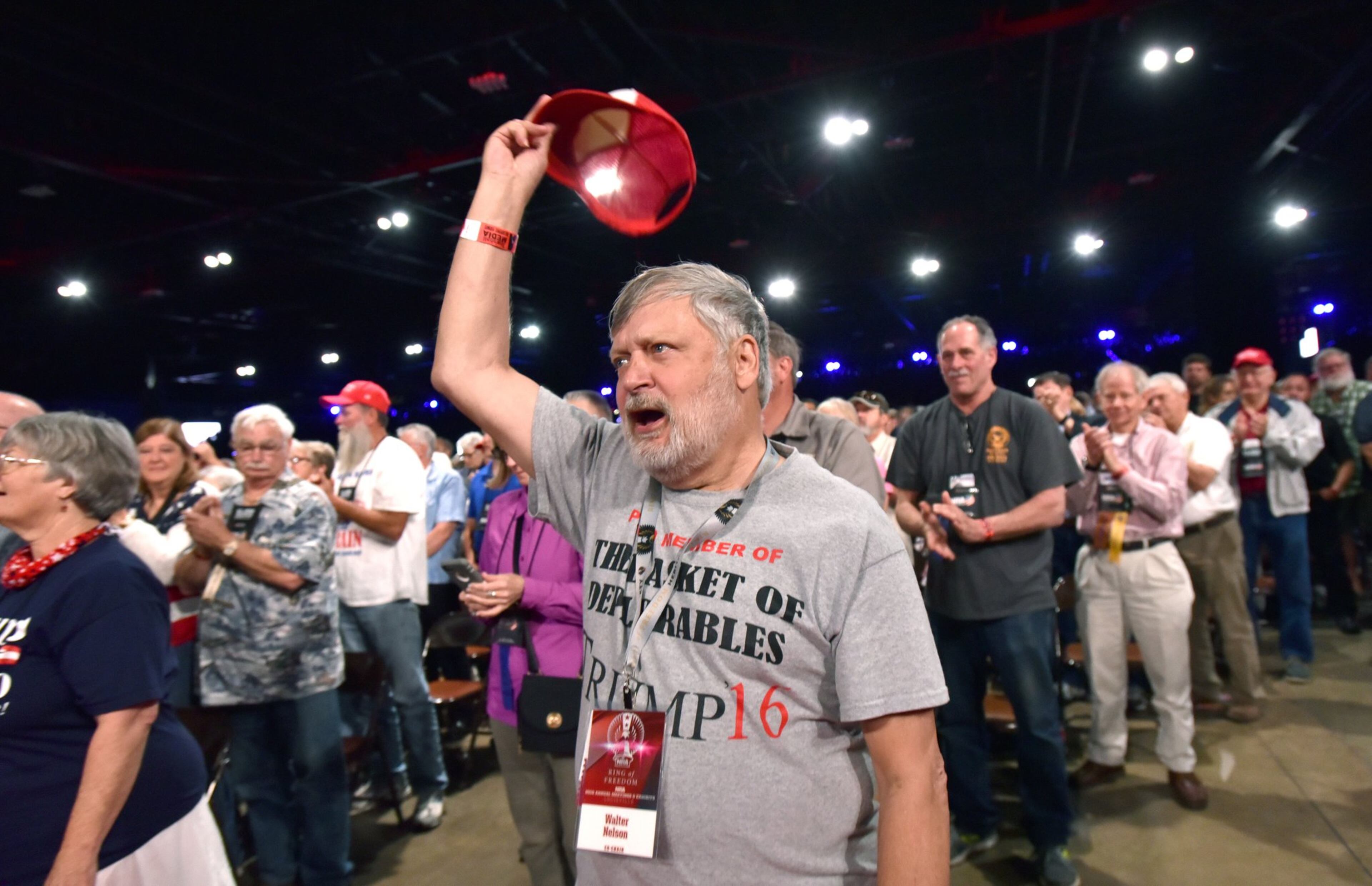 A sea of white faces cheers on President Trump at the NRA convention last week. Hyosub Shin / hshin@ajc.com