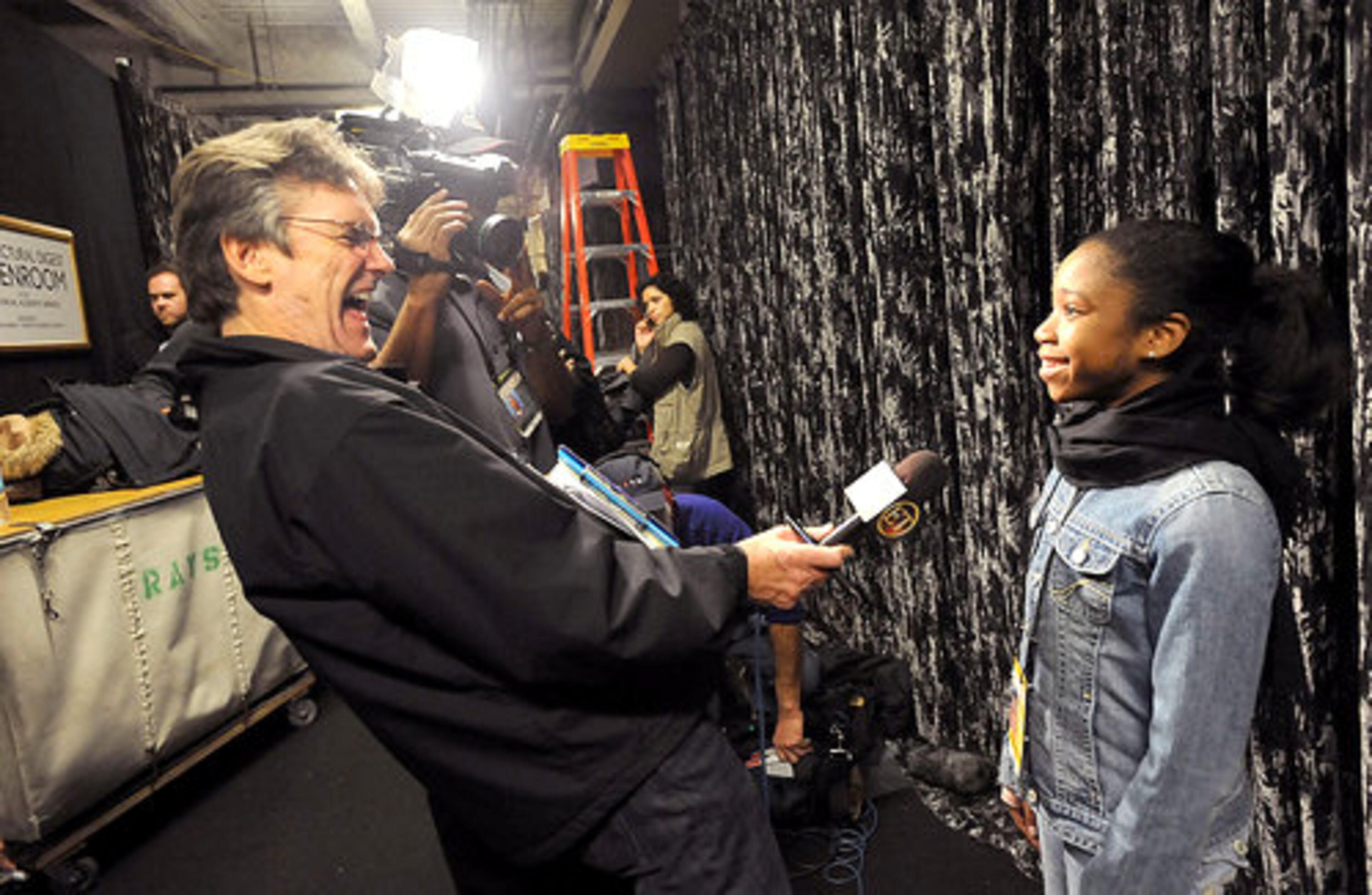 Jamia Nash, 11, will perform in Sunday night's Academy Awards show. Entertainment Tonight's Martin Mackey (left) reacts to Jamia's answer backstage of the Kodak Theatre in Hollywood, Calif., after an official rehearsal on Friday.