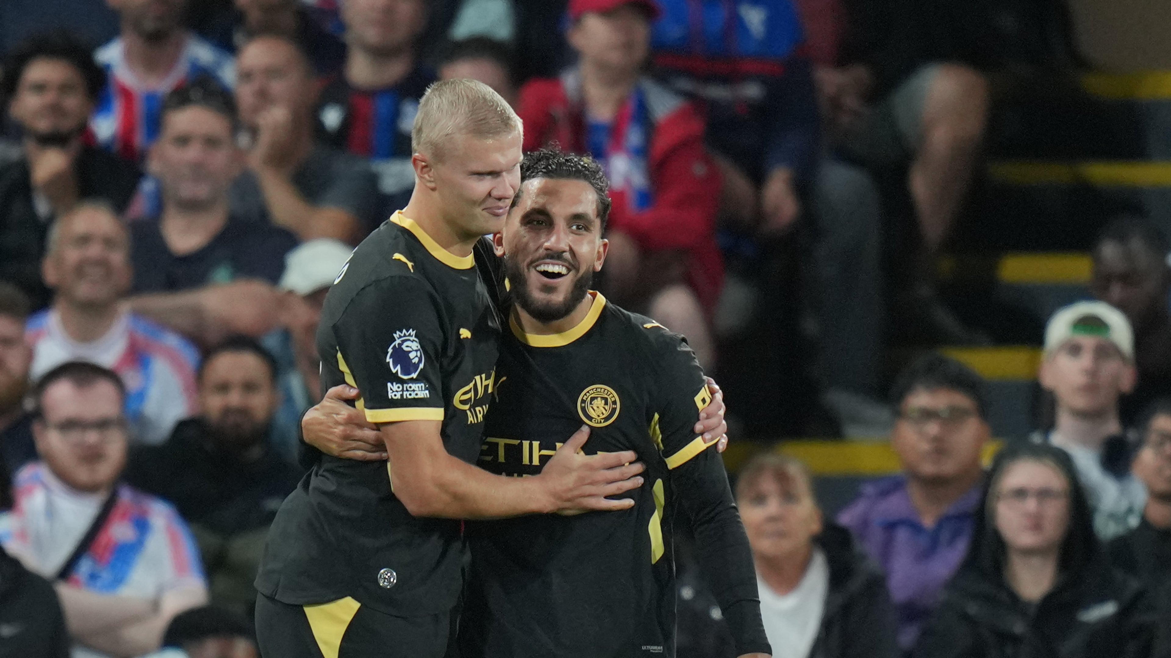 Manchester City's Rayan Cherki, right, celebrates with Erling Haaland after scoring his side's third goal during the English Premier League soccer match between Crystal Palace and Manchester City in London, Friday, Aug. 28, 2026. (AP Photo/Kin Cheung)