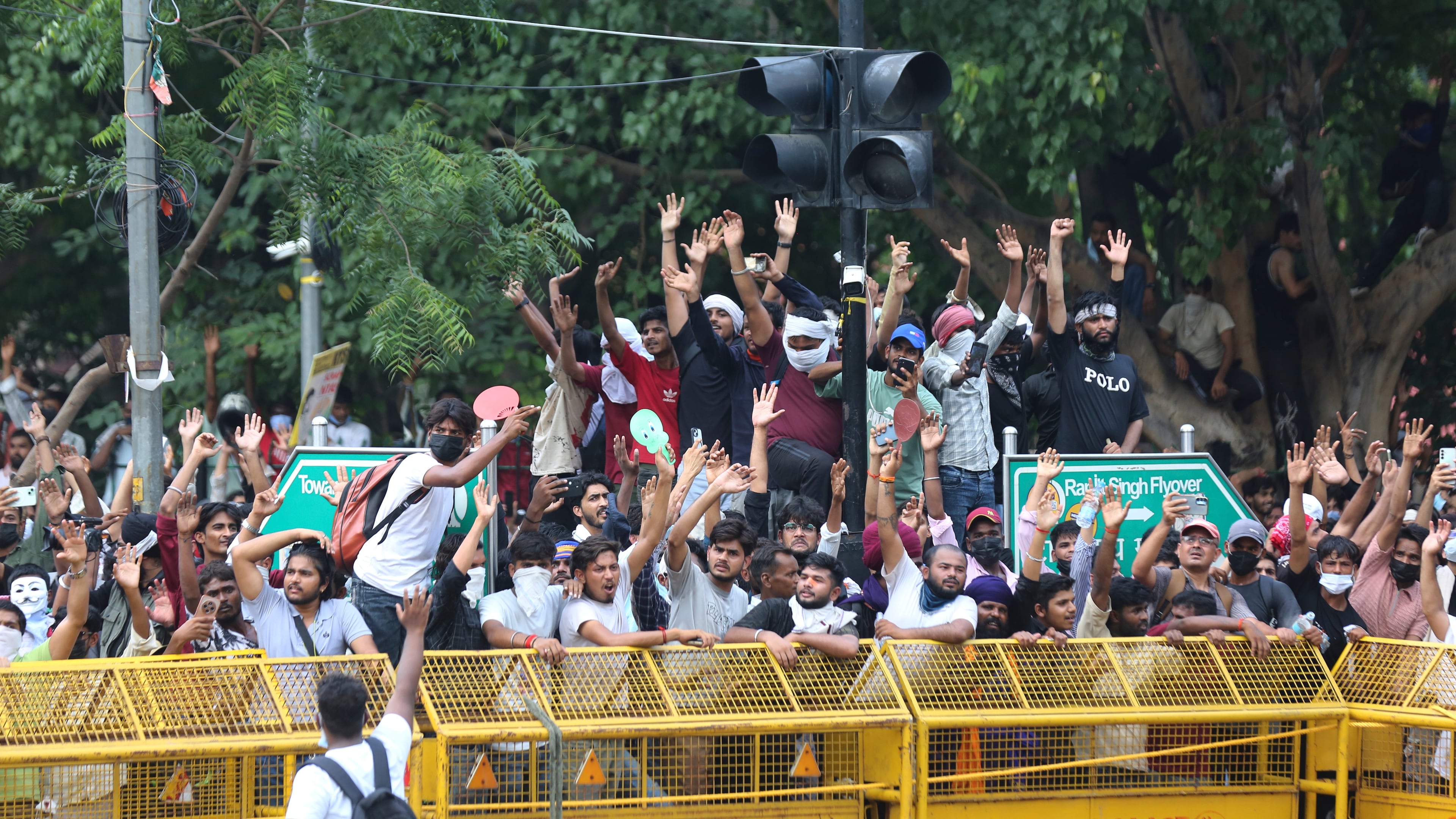 Protesters react after India's Education Minister Dharmendra Pradhan resigned following nationwide protests as part of the Cockroach Janta Party's protest movement in New Delhi, India, Saturday, July 25, 2026. (AP Photo/Vipin)