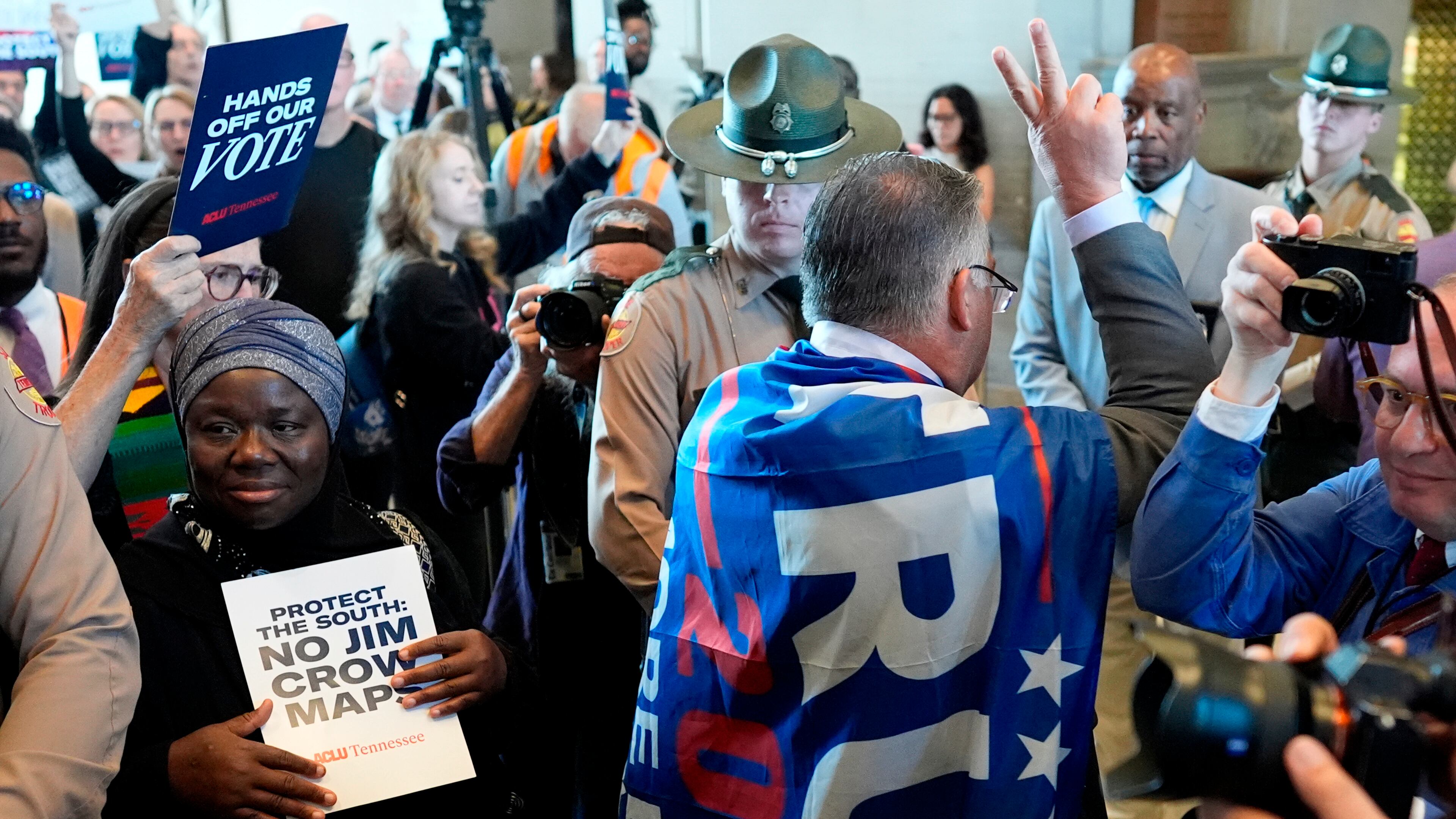 Rep. Todd Warner, R-Chapel Hill, arrives to the House chamber wearing a Trump flag for a special session of the state legislature to redraw U.S. Congressional voting maps Thursday, May 7, 2026, in Nashville, Tenn. (AP Photo/George Walker IV)