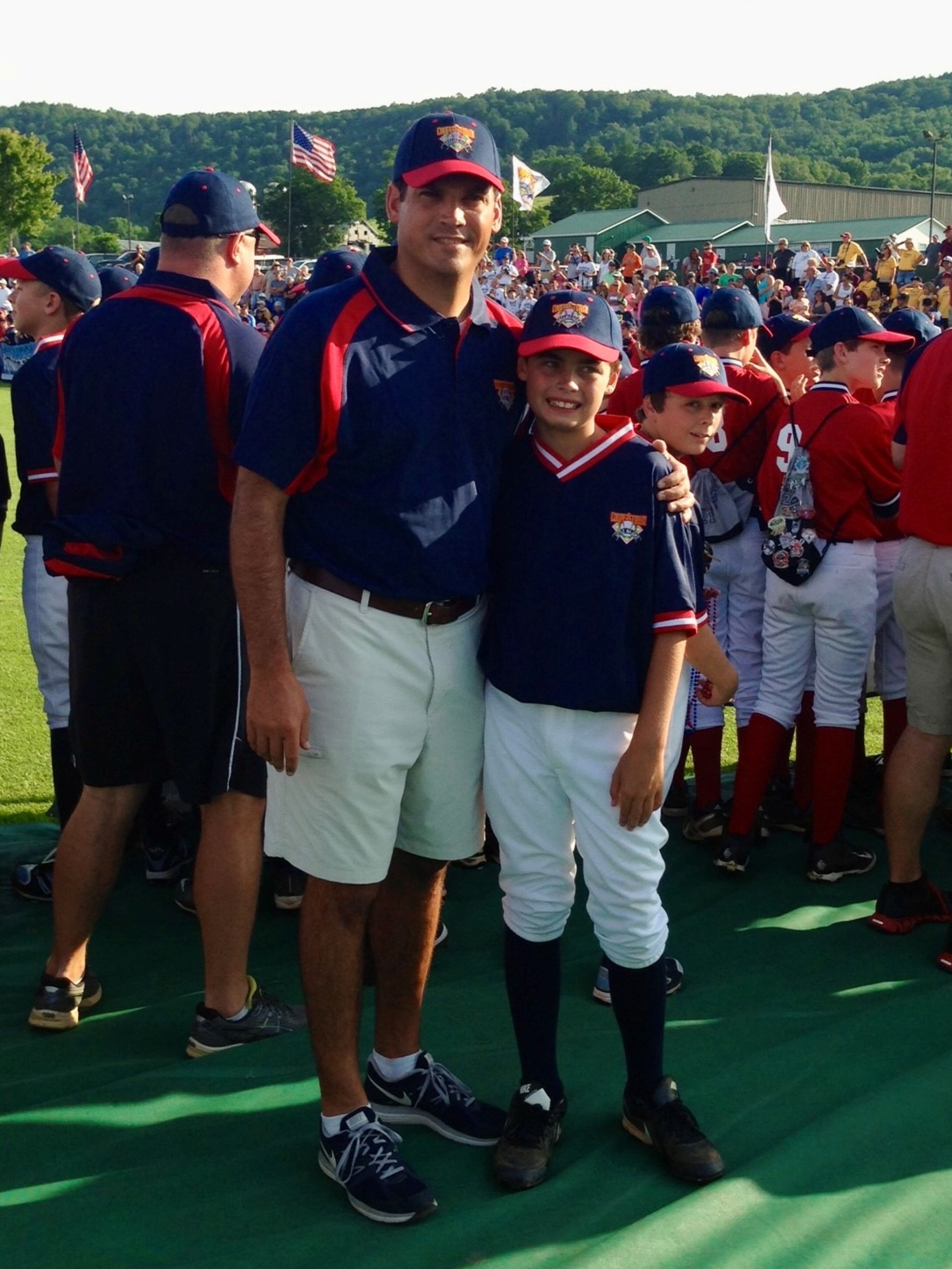 AJC contributor Geoff Duncan (left) and his oldest son, Parker, stand together at opening ceremonies in Cooperstown, N.Y. (Courtesy of Geoff Duncan)