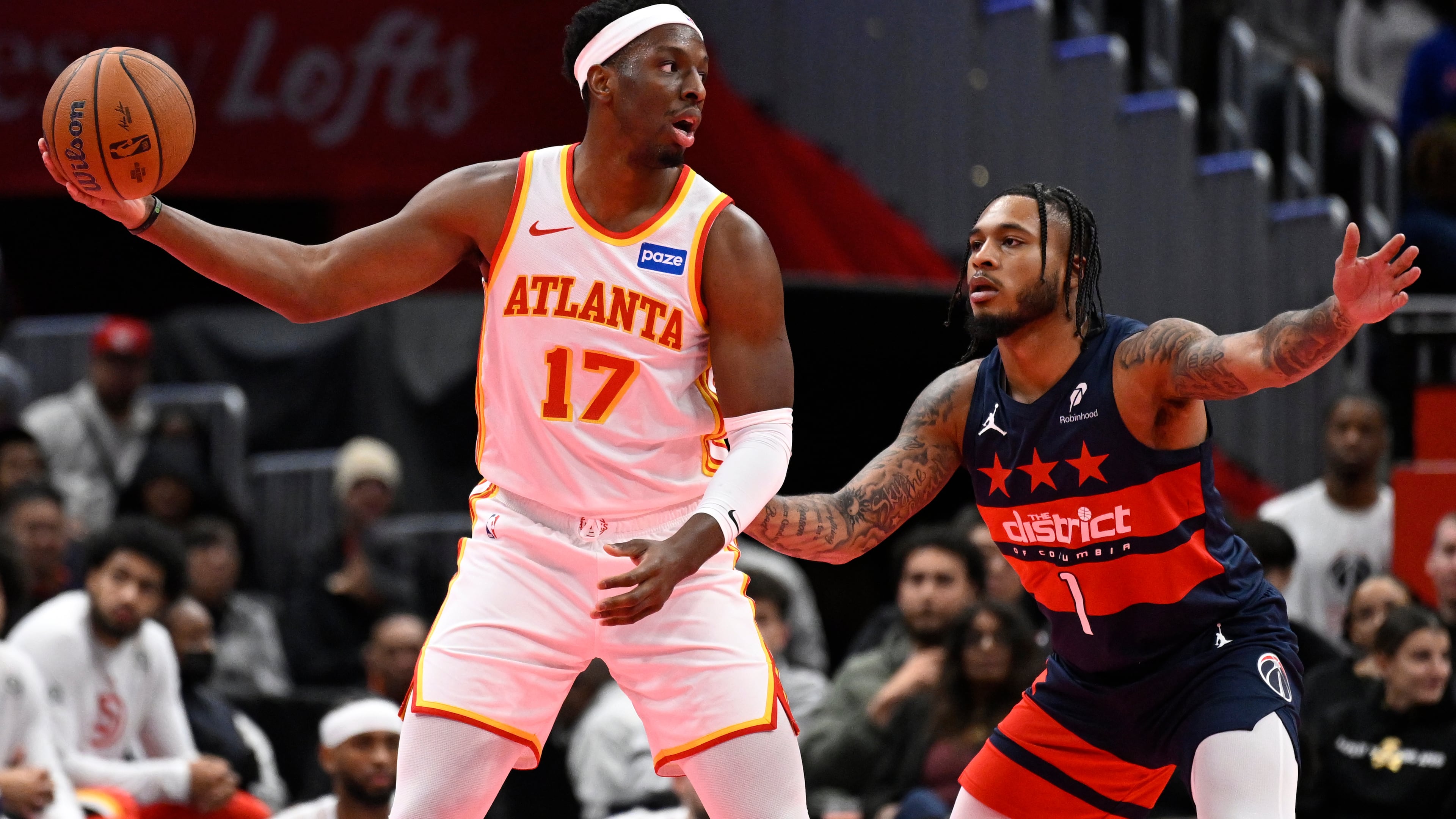 Atlanta Hawks forward Onyeka Okongwu is guarded by Washington Wizards forward Cam Whitmore during the first half of a Emirates NBA Cup basketball game Tuesday. (John McDonnell/AP)