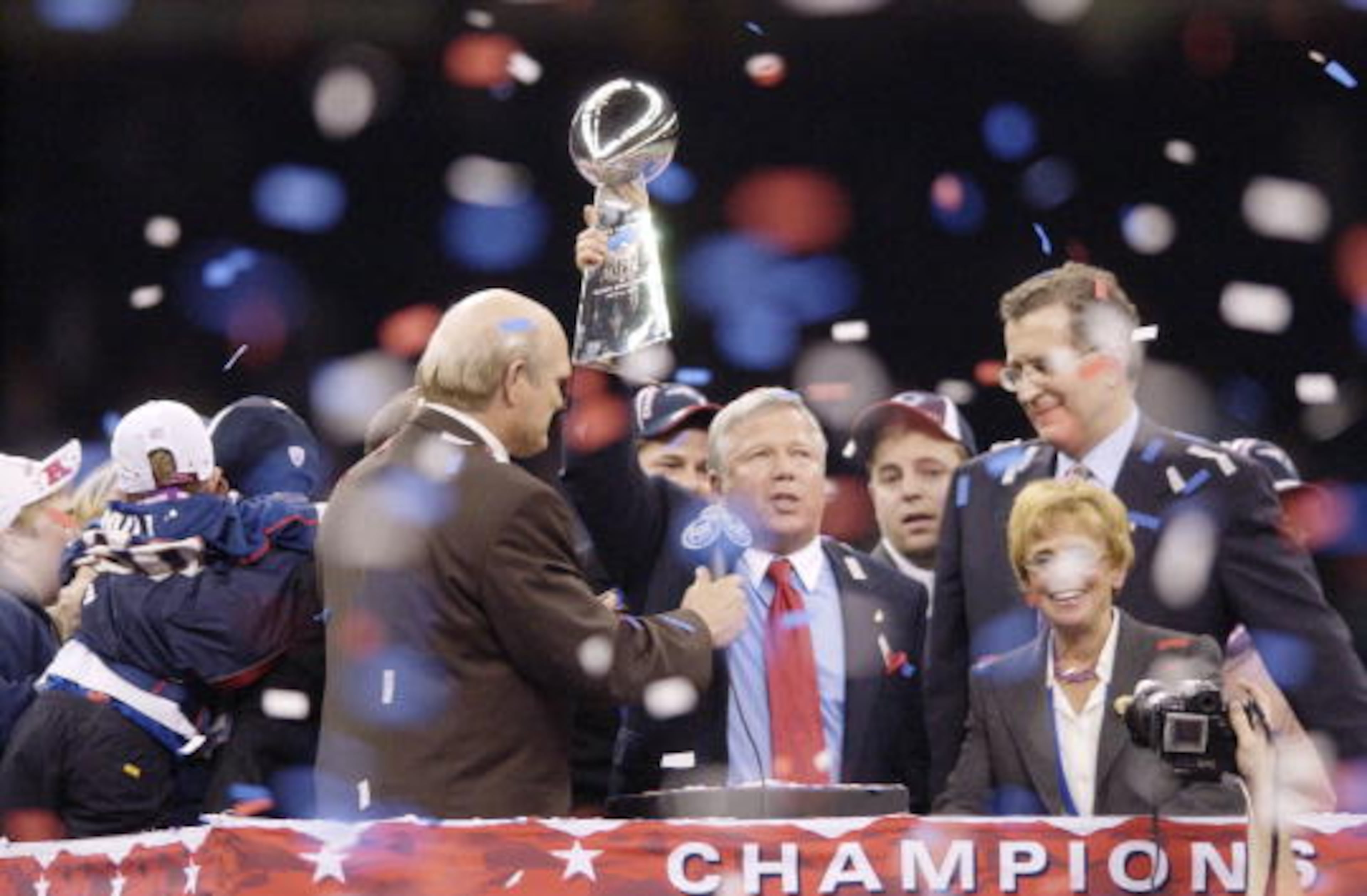 03 Feb 2002: New England patriots owner/chairman Bob Kraft adresses the crowd and sport commentator Terry Bradshaw (L) as he is presented with the trophy during post-game celebration of Superbowl XXXVI at the Superdome in New Orleans, Louisiana. The Patriots won 20-17, with a 48-yard field goal by kicker Adam Vinatieri with 10 seconds left in the game . DIGITAL IMAGE. Mandatory Credit: Ezra Shaw/Getty Images