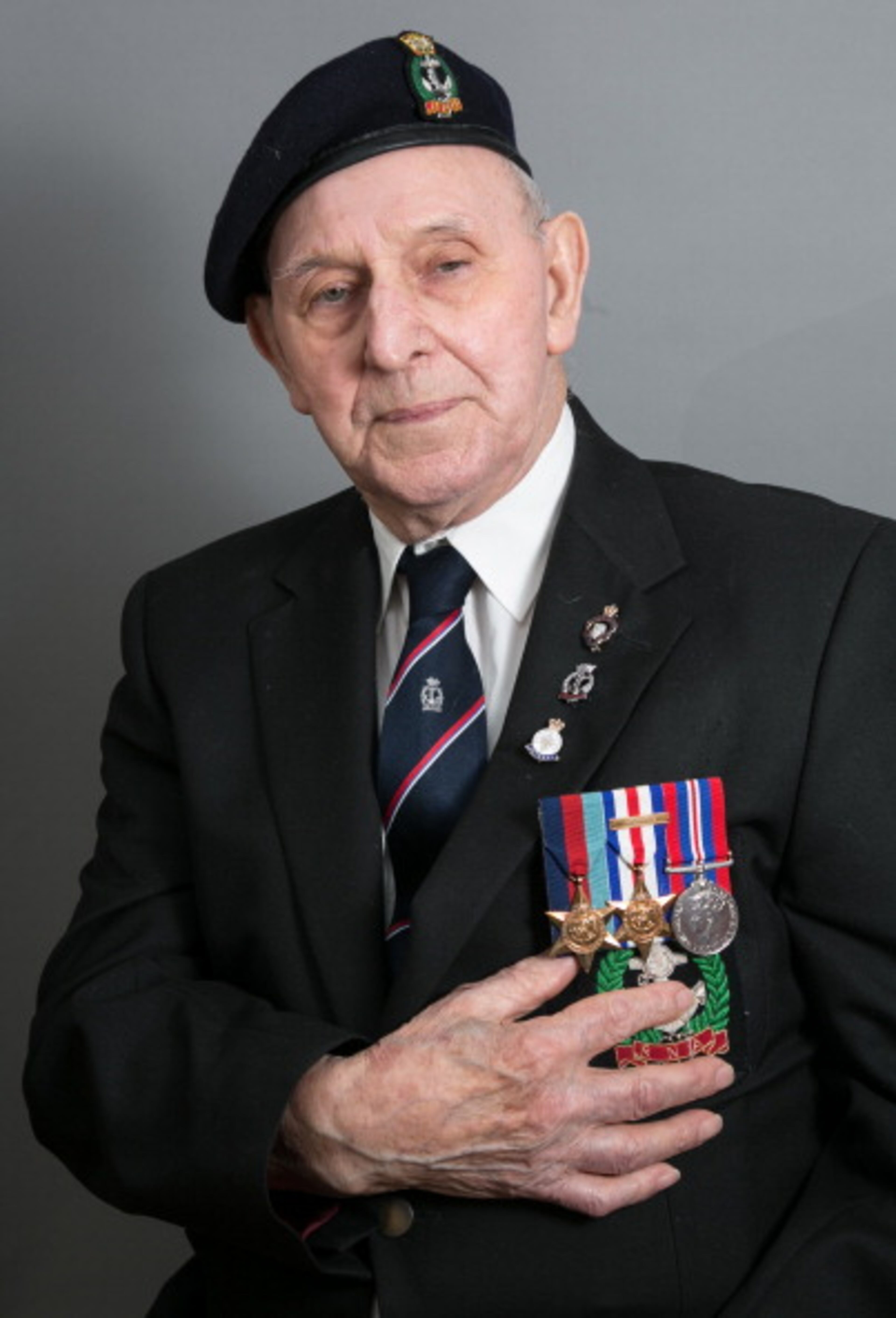 Normandy veteran Eddie Linton poses for a photograph at his home in Newport on March 21, 2014 in Gwent, Wales. On D-Day, June 6 1944, the 88-year-old was a Royal Navy able seaman (AB) on board the River-class frigate HMS Mourne. Asked what his most vivid memory of D-Day was he replied: 'Coming on deck for watch early that morning and seeing all those ships. Id never seen so many ships in all my life. Thats when I knew something was going to happen.' (Photo by Matt Cardy/Getty Images)
