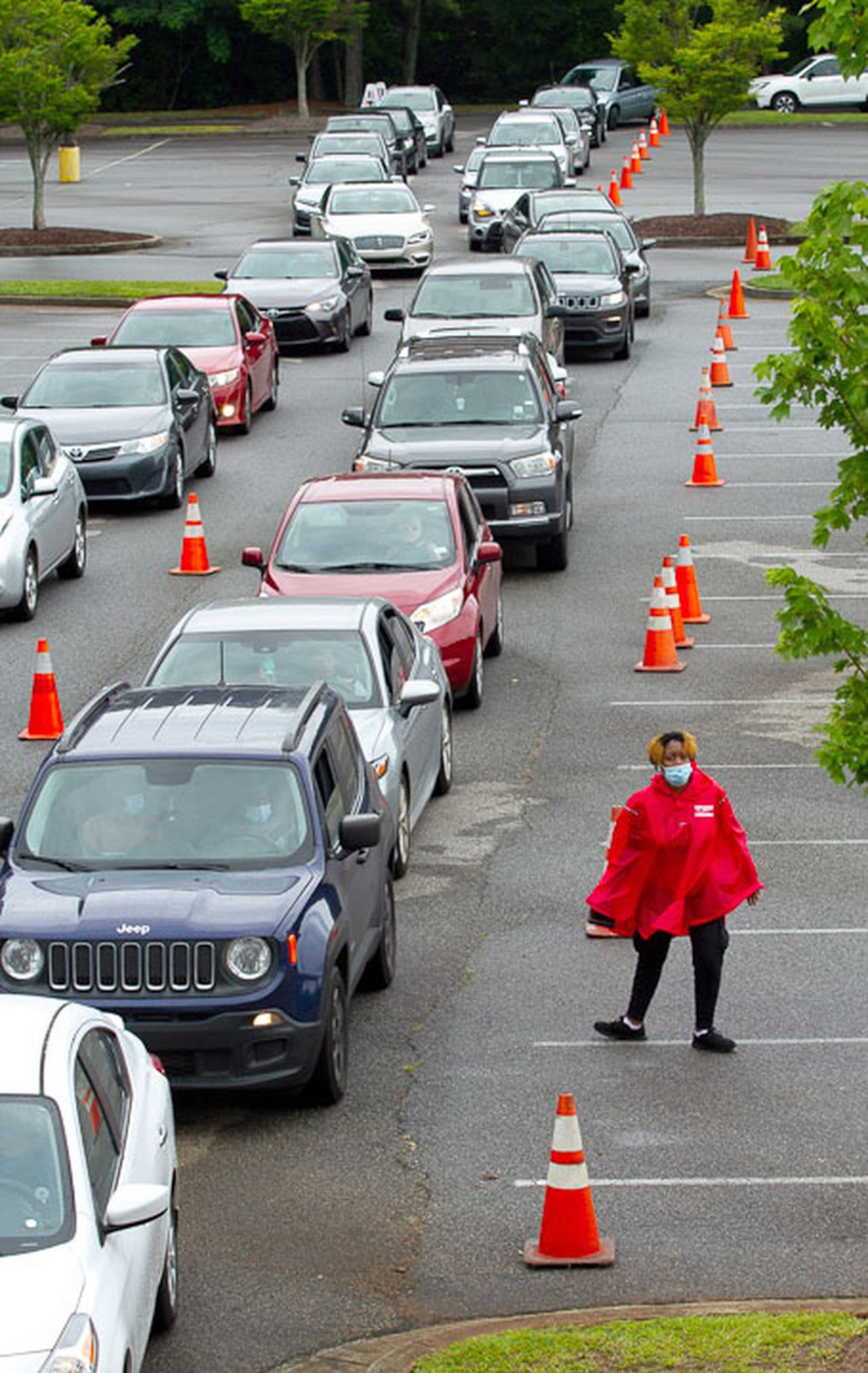 Cars line up Wednesday at the COVID-19 testing center at Greenforest Community Baptist Church in Decatur.
