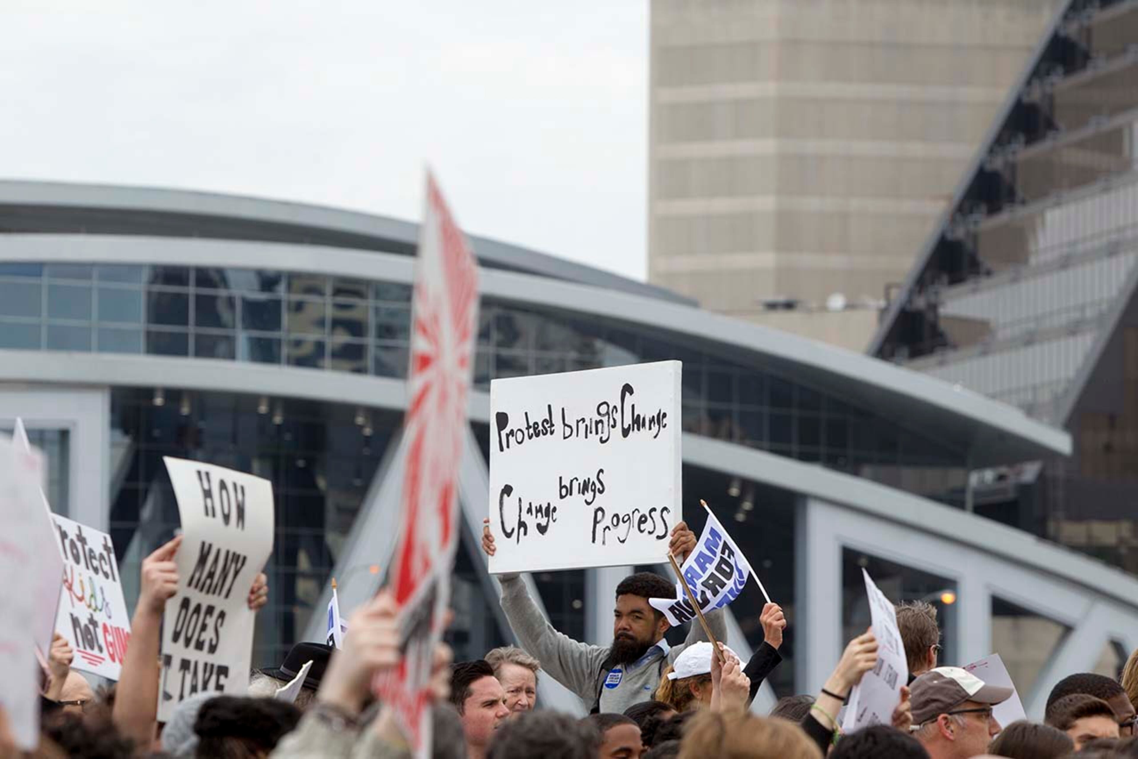 A man holds up a sign during the March for our Lives event in Atlanta, Georgia, on Saturday, March 24, 2018. (REANN HUBER/REANN.HUBER@AJC.COM)