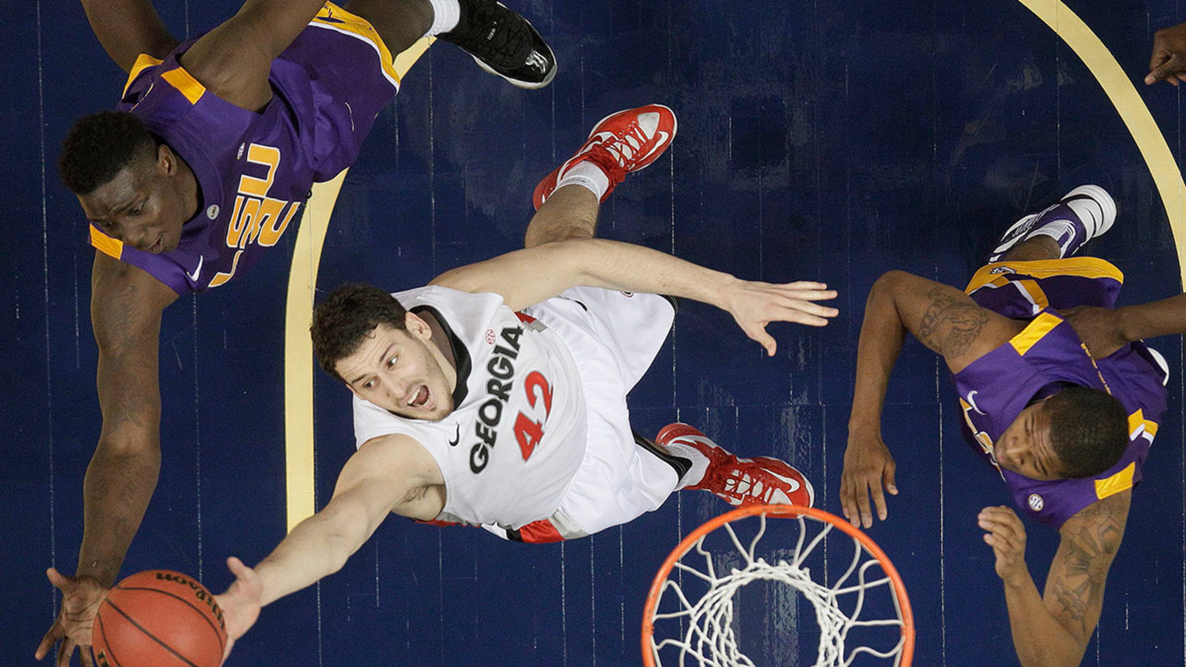 Georgia forward Nemanja Djurisic (42) vies for a rebound against LSU guard Malik Morgan (24) and LSU forward Johnny O'Bryant III (2).