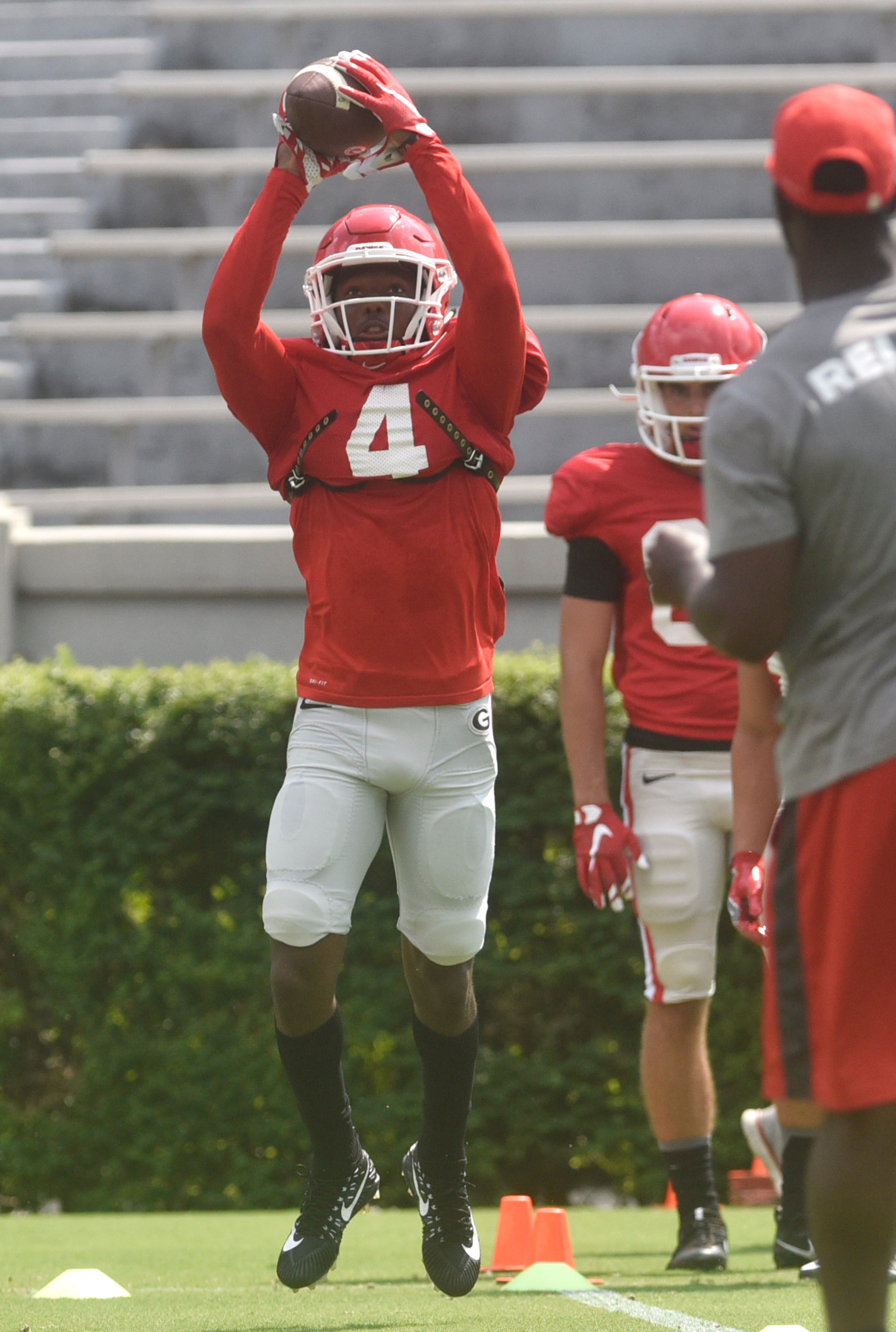 Georgia wide receiver Mecole Hardman (4) practices catches during an open practice during the annual UGA Fan Day at Sanford Stadium on Saturday, Aug 5, 2017 in Athens, Ga.
(RICHARD HAMM)