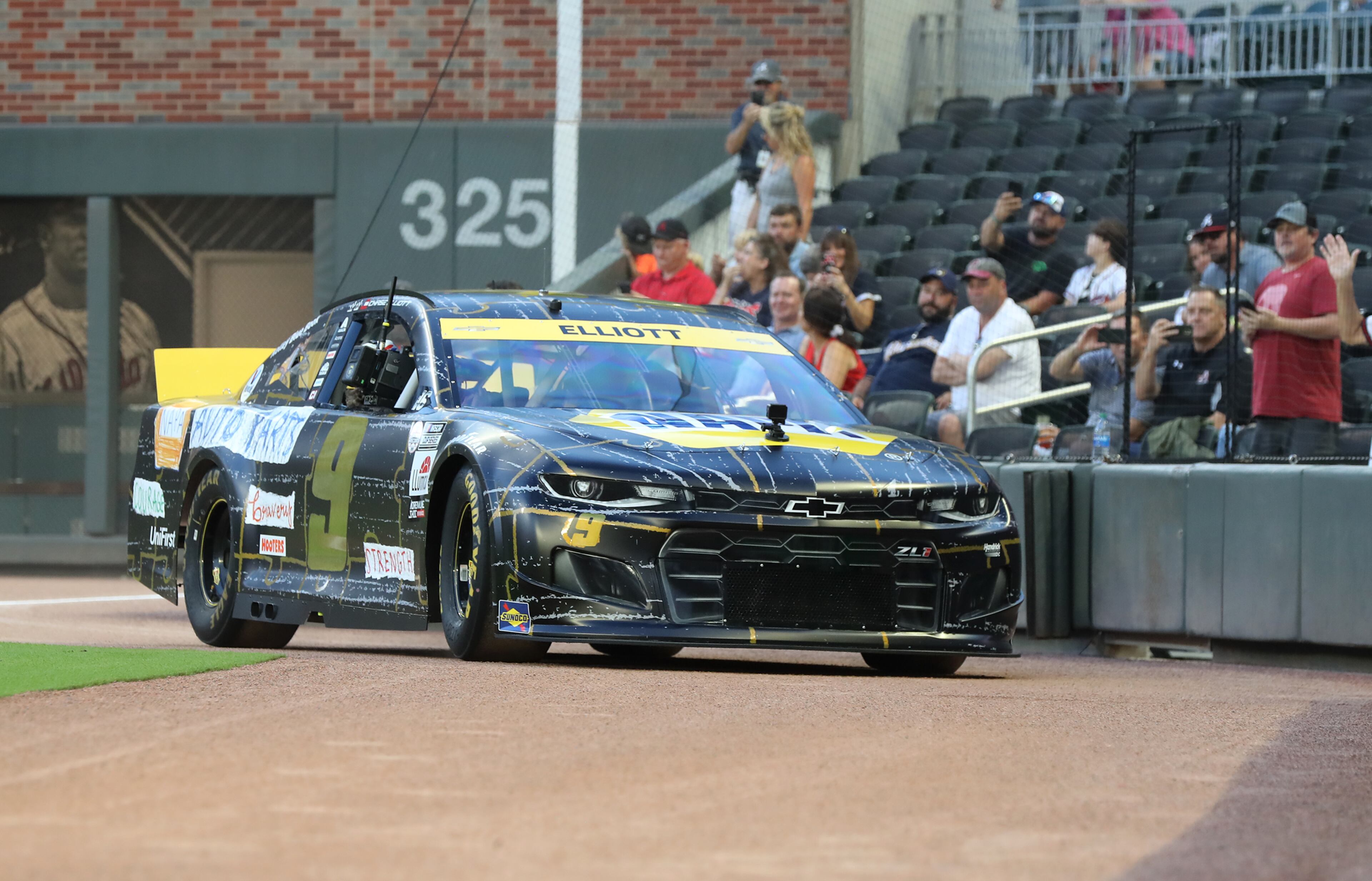 NASCAR driver Chase Elliott takes a lap around the Truist Park field before the Braves play the Washington Nationals. “Curtis Compton / Curtis.Compton@ajc.com”