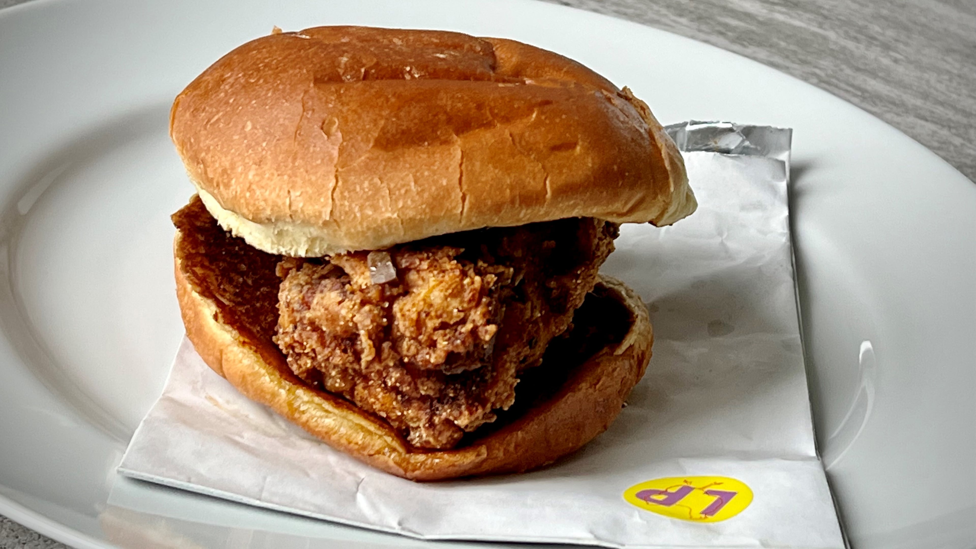 Farm Birds, a ghost kitchen run by Farm Burger, offers a lemon pepper wet chicken sandwich. Henri Hollis/henri.hollis@ajc.com