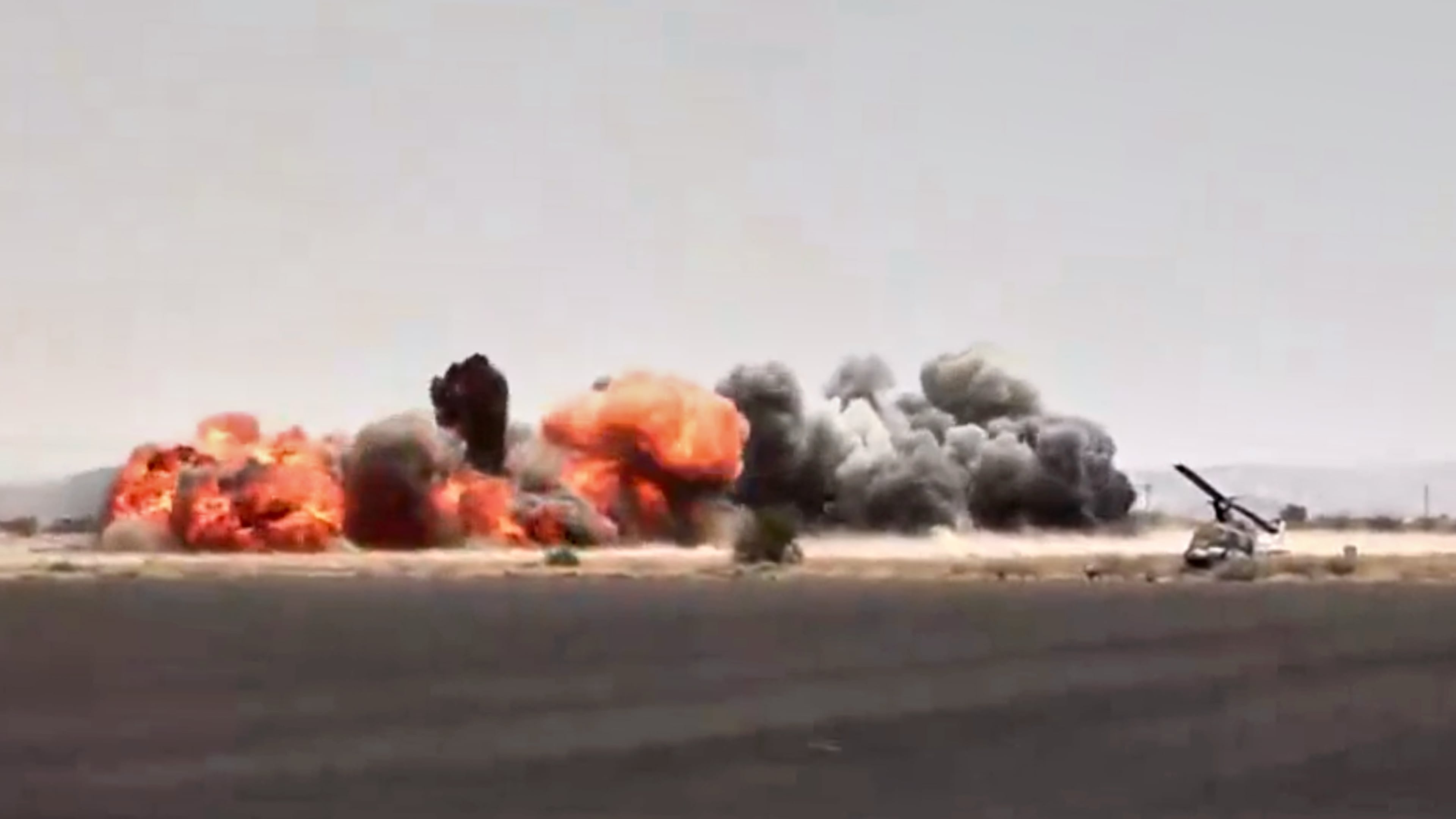 This image taken from video broadcast by Al-Masirah TV, a Houthi-controlled news channel, shows an explosion at the Sanaa International Airport compound during what the Iranian-backed Houthi rebels in Yemen said were several Saudi airstrikes in Sanaa, Yemen, Monday, July 13, 2026. (Al-Masirah TV via AP)