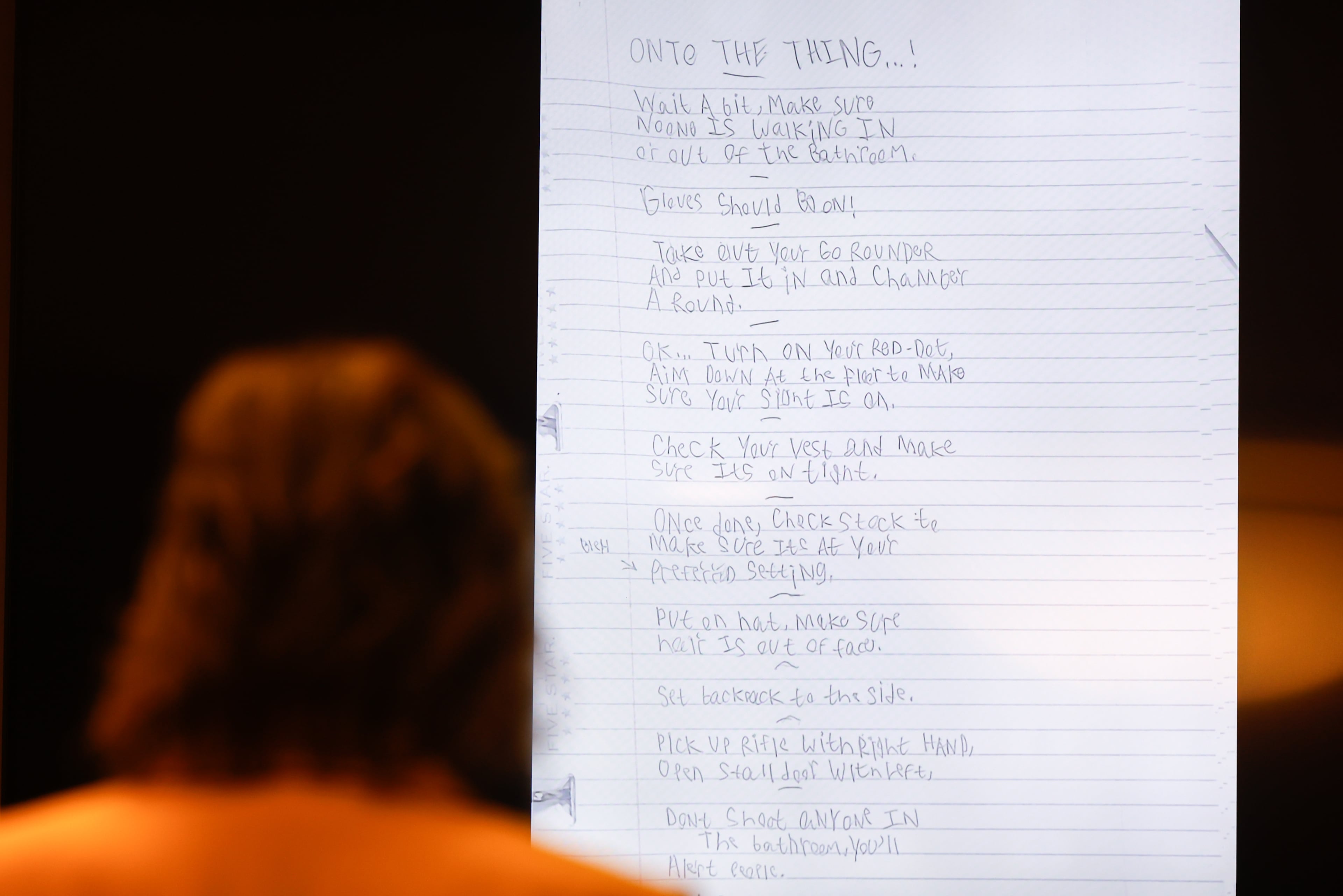 A screen displays the shooting “plan” written in the binder of Colt Gray, the 16-year-old Apalachee High School shooting suspect, at Barrow County Superior Court in Winder on July 24, 2026. Four people died and nine were injured at the school shooting in Barrow County on Sept. 4, 2024. (Arvin Temkar/AJC)
