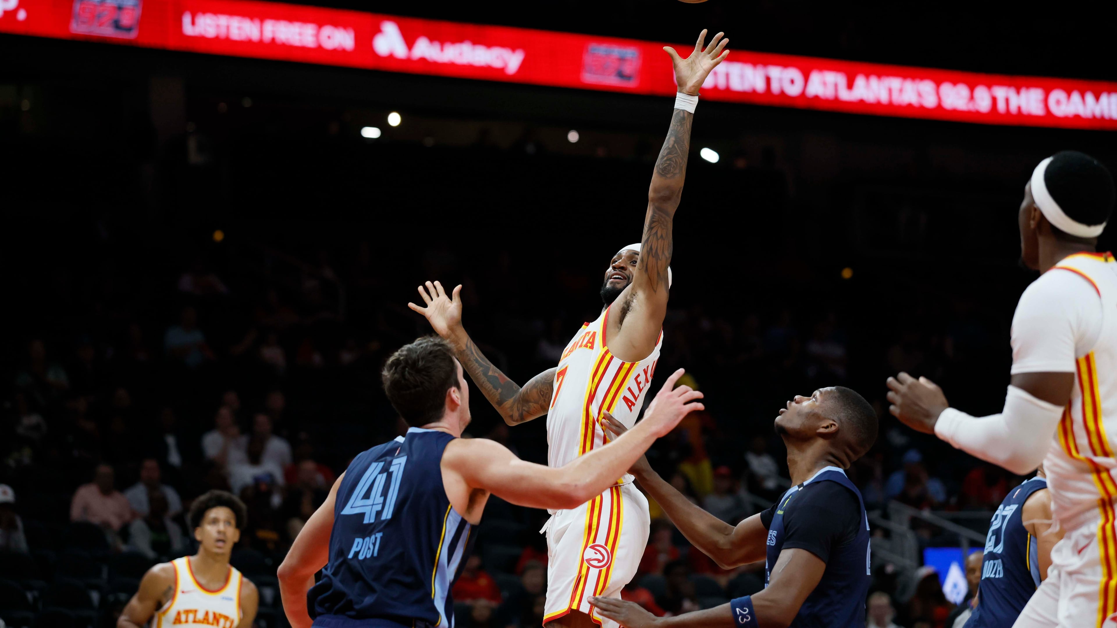 Atlanta Hawks guard Nickeil Alexander-Walker goes up for a basket against Memphis Grizzlies center Quinten Post in a preseason Oct. 5, 2026. (Miguel Martinez/AJC)