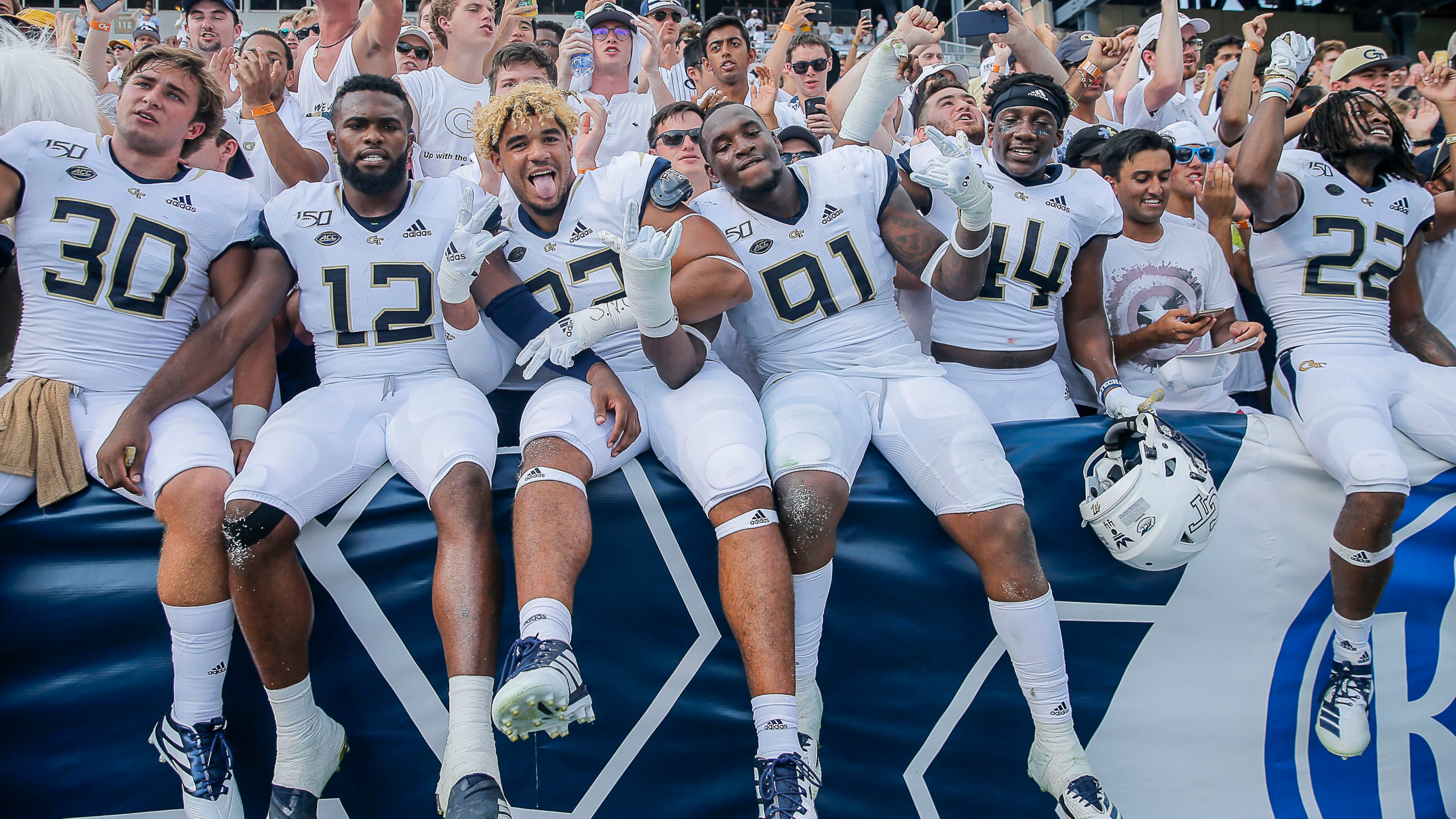The Georgia Tech Yellow Jackets celebrate following the game against the South Florida Bulls at Bobby Dodd Stadium. Tech won 14-10. (Alyssa Pointer/alyssa.pointer@ajc.com)