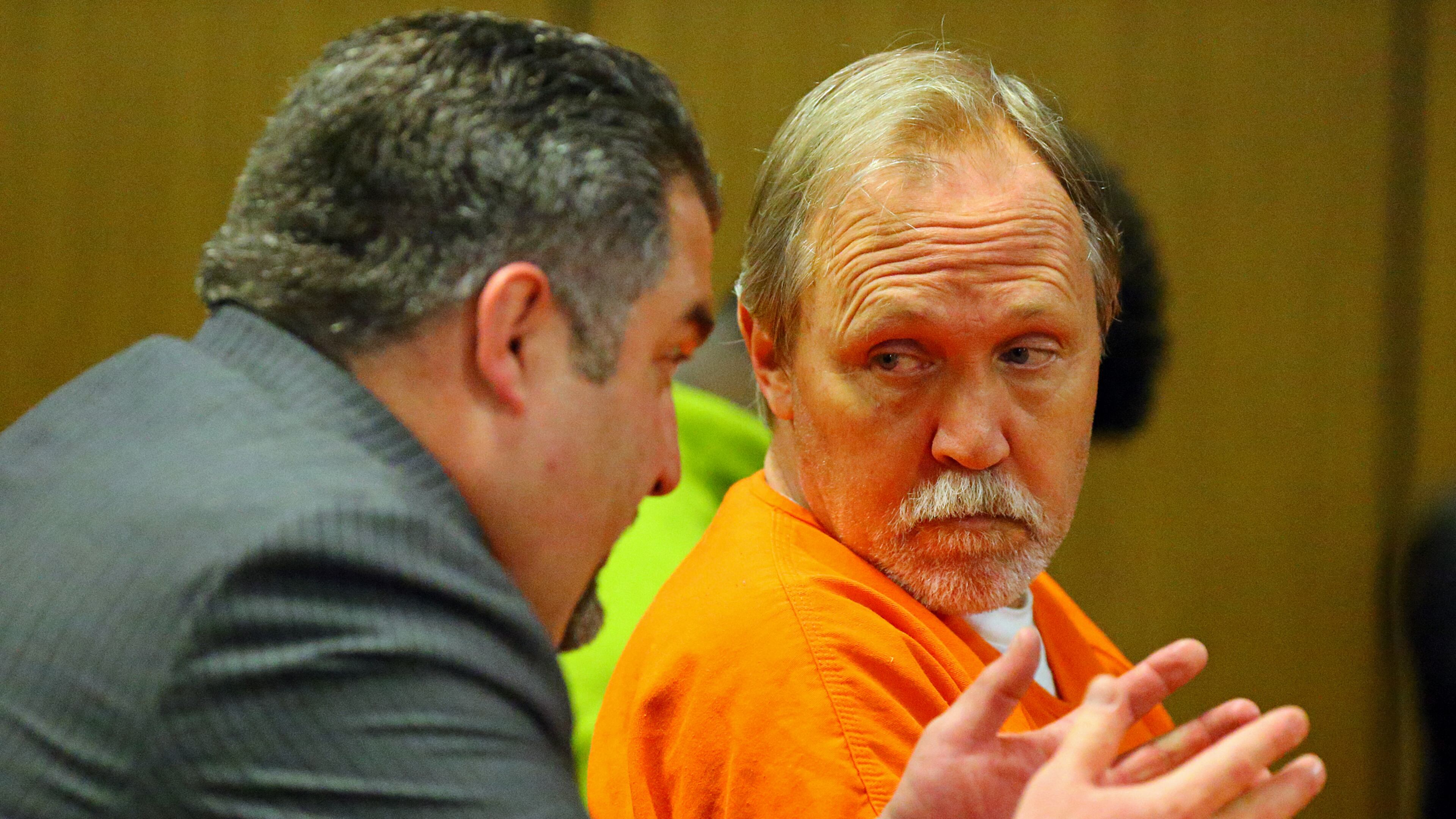 John McGill, principal of Mt. Carmel Elementary School in Douglas County, confers with his attorney Mac Pilgrim during his first appearance hearing at DeKalb County Magistrate Court on Tuesday, March 4, 2014, in Decatur. He is accused of a felony offense of electronic pornography and child exploitation.