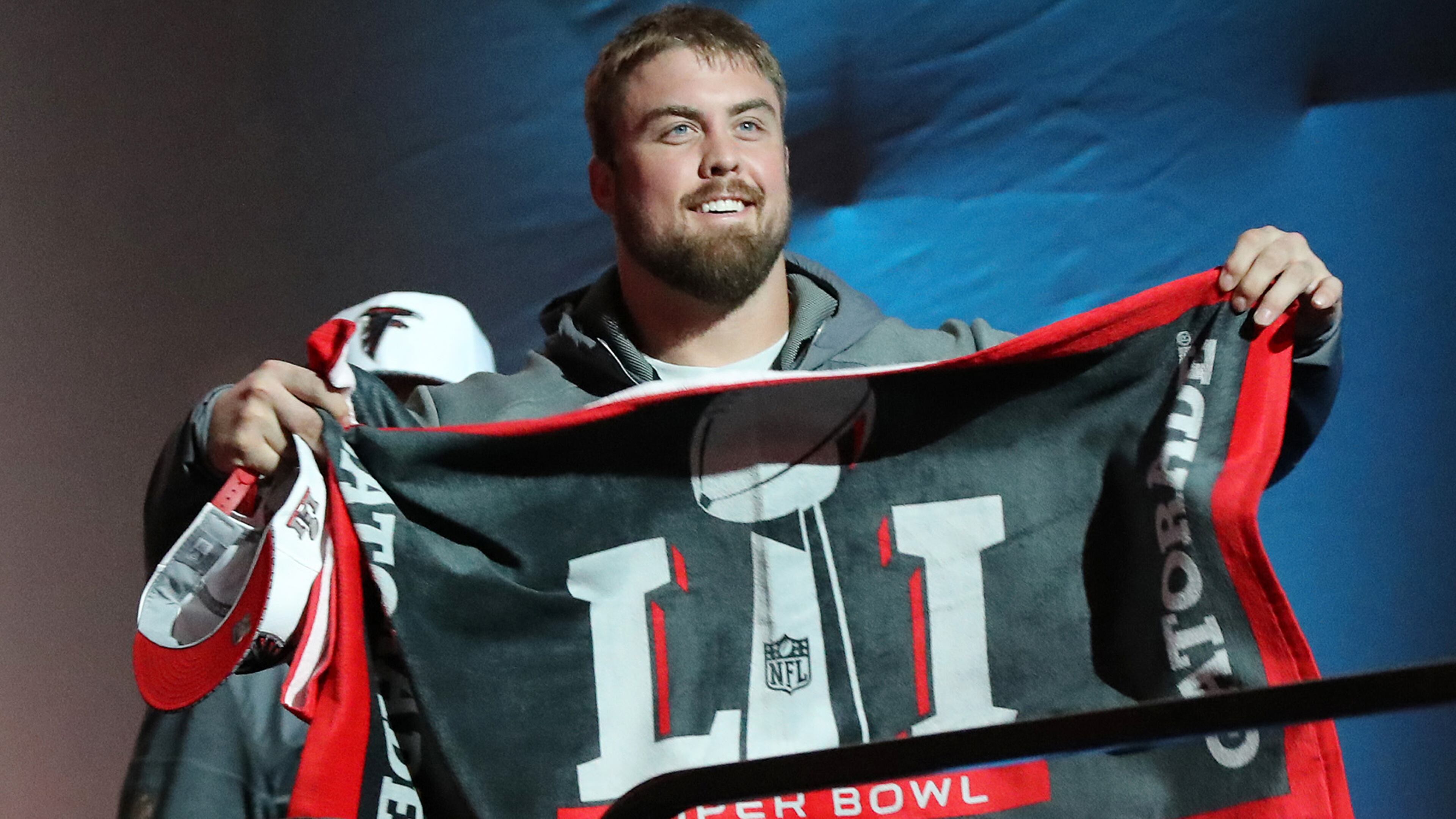 Falcons guard Ben Garland flashes a Super Bowl towel as he takes the stage for Super Bowl Opening Night on Monday, Jan. 30, 2017, at Minute Maid Park in Houston.