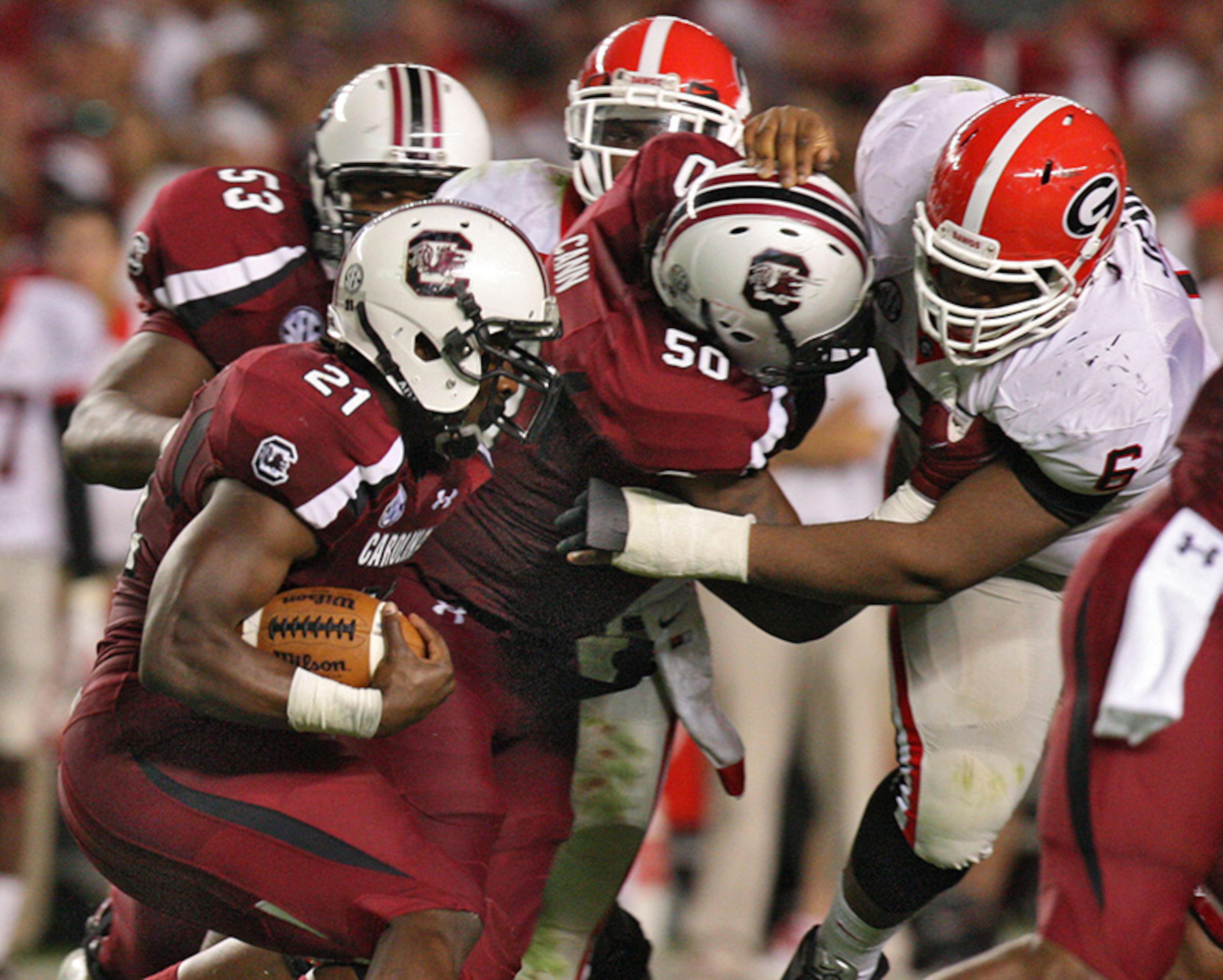 (6) South Carolina 35, (5) Georgia 7, in Columbia, S.C.: Georgia came in with a league-leading 48.2 points and 536 yards per game of offense -- and where shut down by the Gamecocks. Connor Shaw threw two touchdown passes and ran for another, Ace Sanders had a dazzling 70-yard punt return touchdown and South Carolina's defense dominated Georgia. Lee Corso's pick? South Carolina.