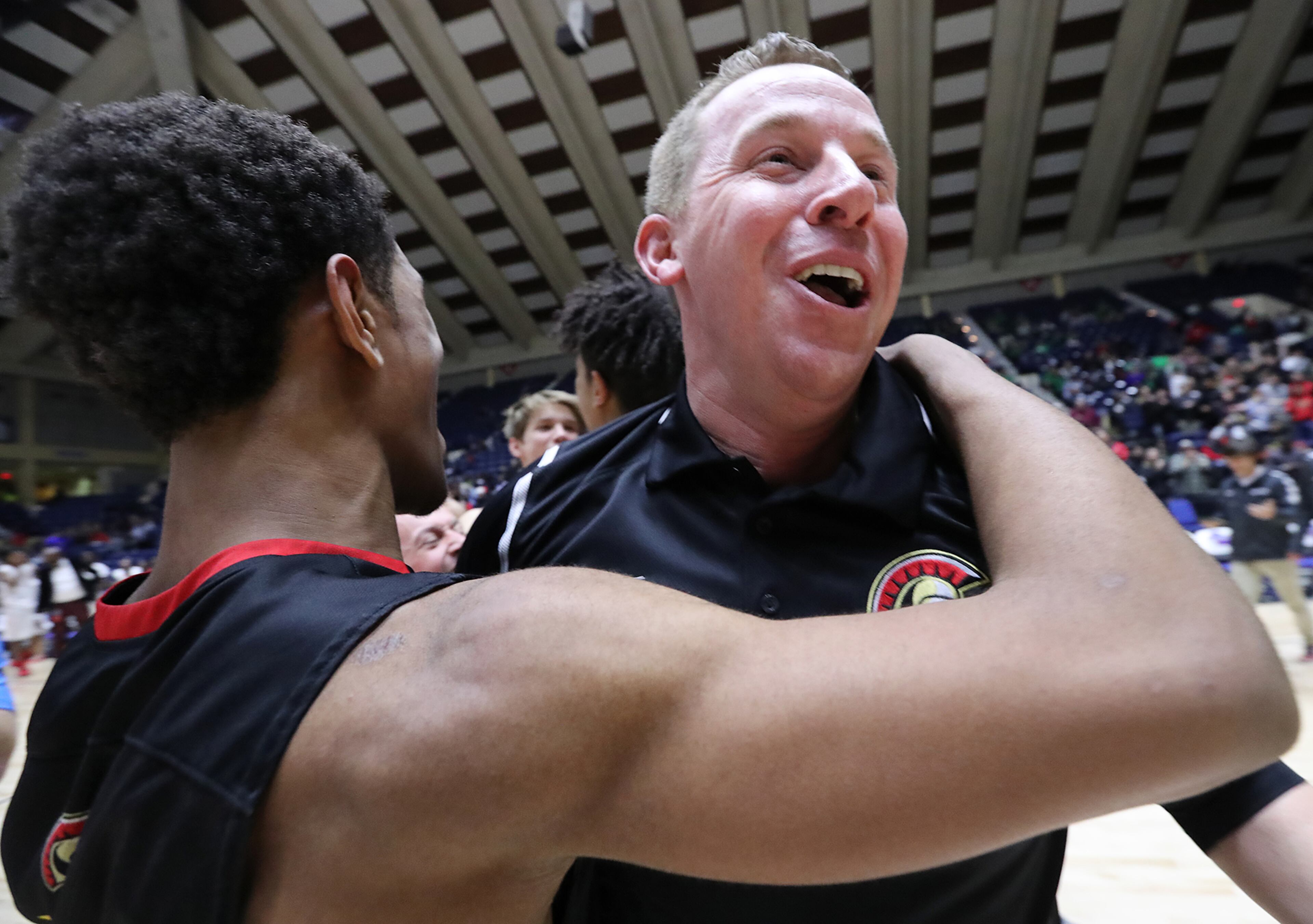 March 8, 2018 Macon: GAC head coach David Eaton celebrates beating Jenkins 67-53 with his players to win their GHSA state basketball championship game on Thursday, March 8, 2018, in Macon. Curtis Compton/ccompton@ajc.com