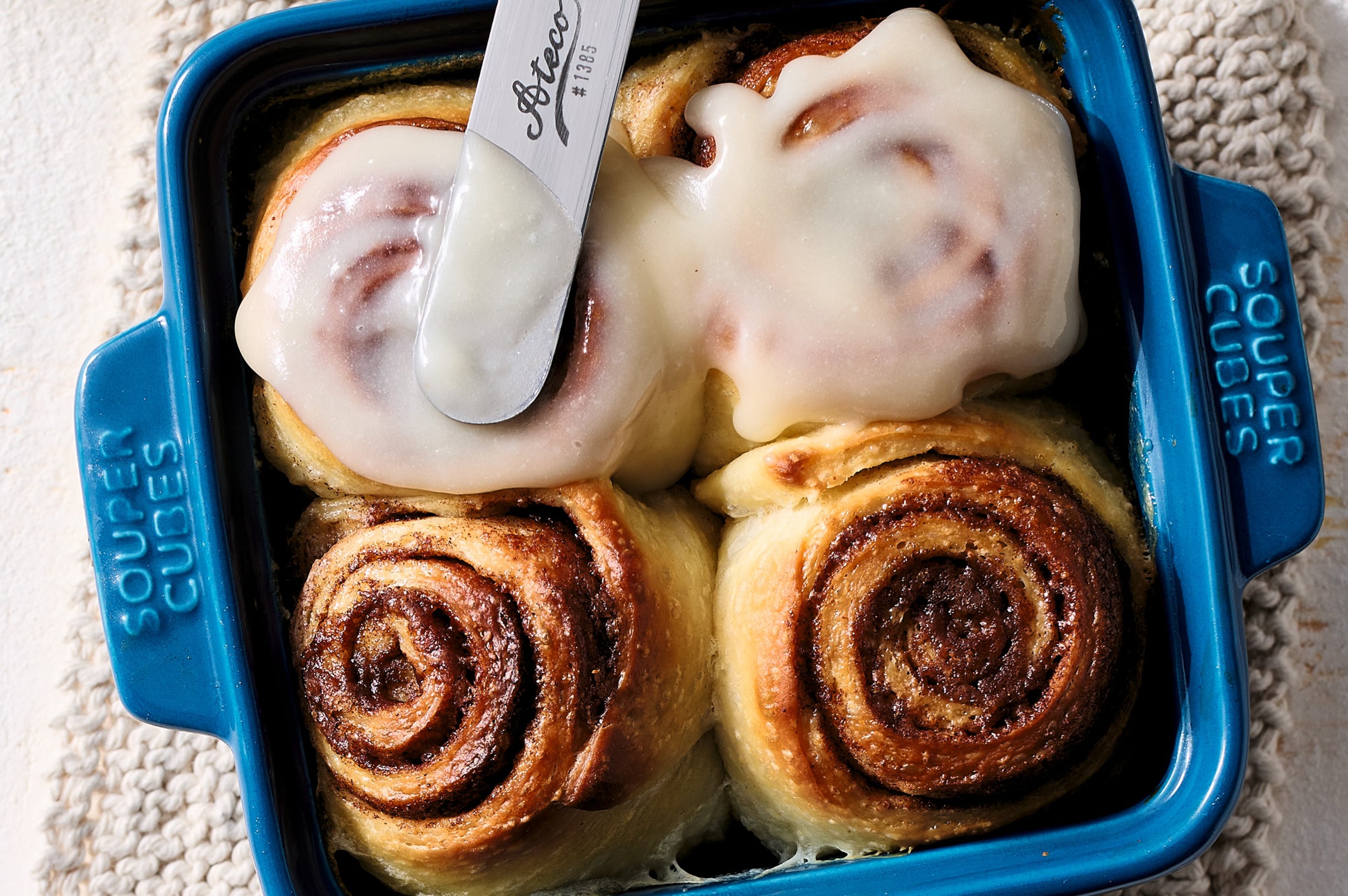 Icing on Ooey-Gooey Cinnamon Rolls, by Rebecca Eisenberg.