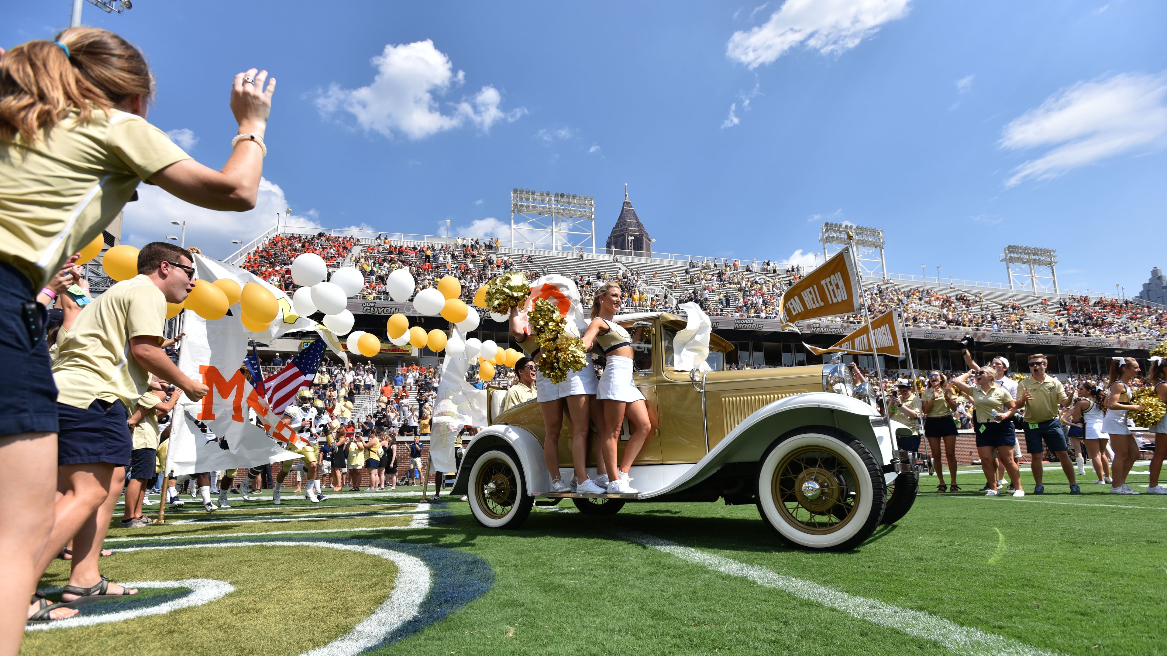 September 10, 2016 Atlanta - Georgia Tech's Ramblin' Wreck leads the band, cheerleaders, Buzz, players, and coaches before the start of the Georgia Tech home opener against against the Mercer on Saturday, September 10, 2016. HYOSUB SHIN / HSHIN@AJC.COM