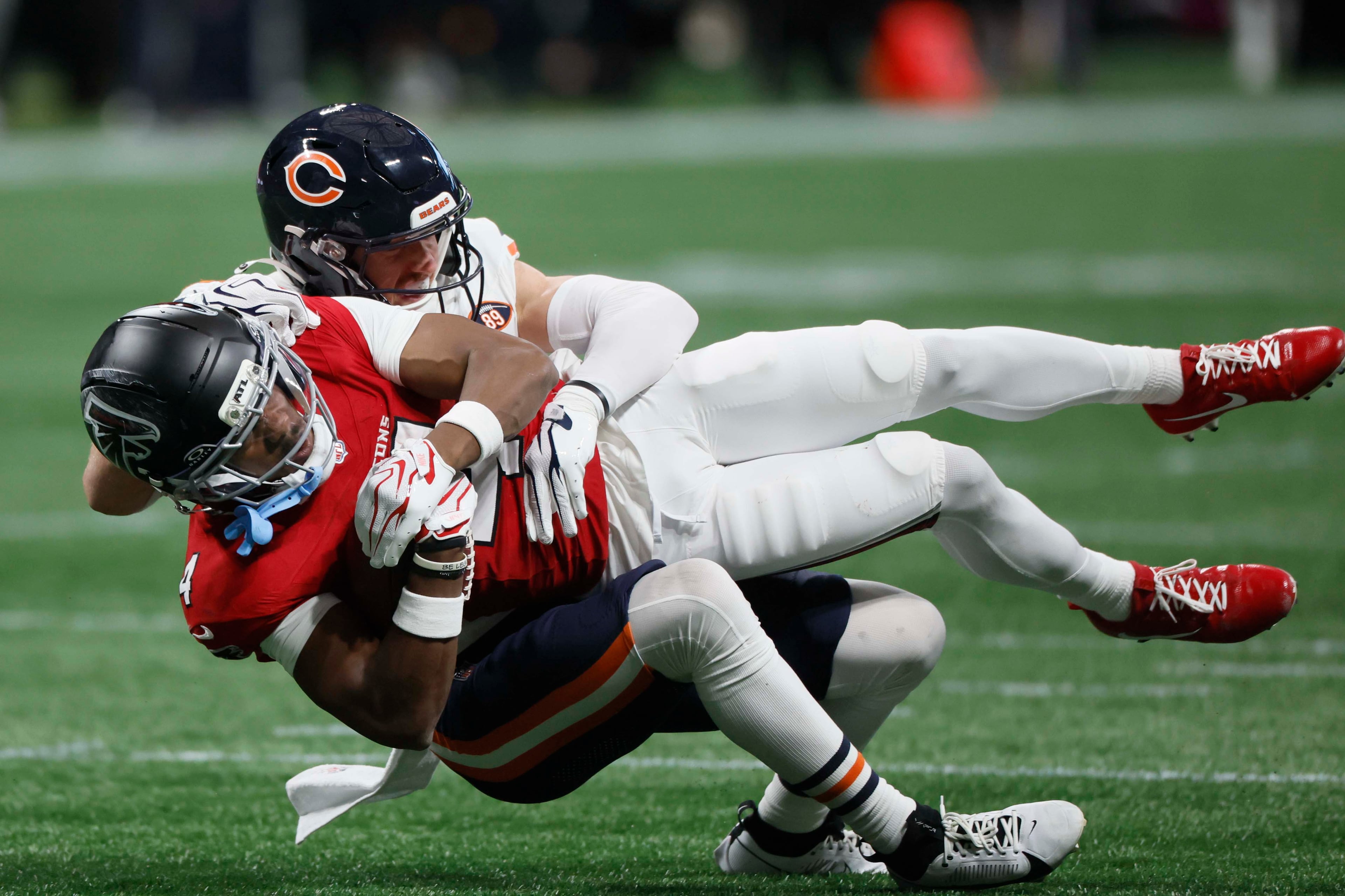 Atlanta Falcons wide receiver Jahan Dotson is tackled after a catch by Chicago Bears safety Dillon Thieneman during the second half of an NFL football game against the Chicago Bears at Mercedes-Benz Stadium in Atlanta on Sunday, Oct. 18, 2026. (Miguel Martinez/AJC)