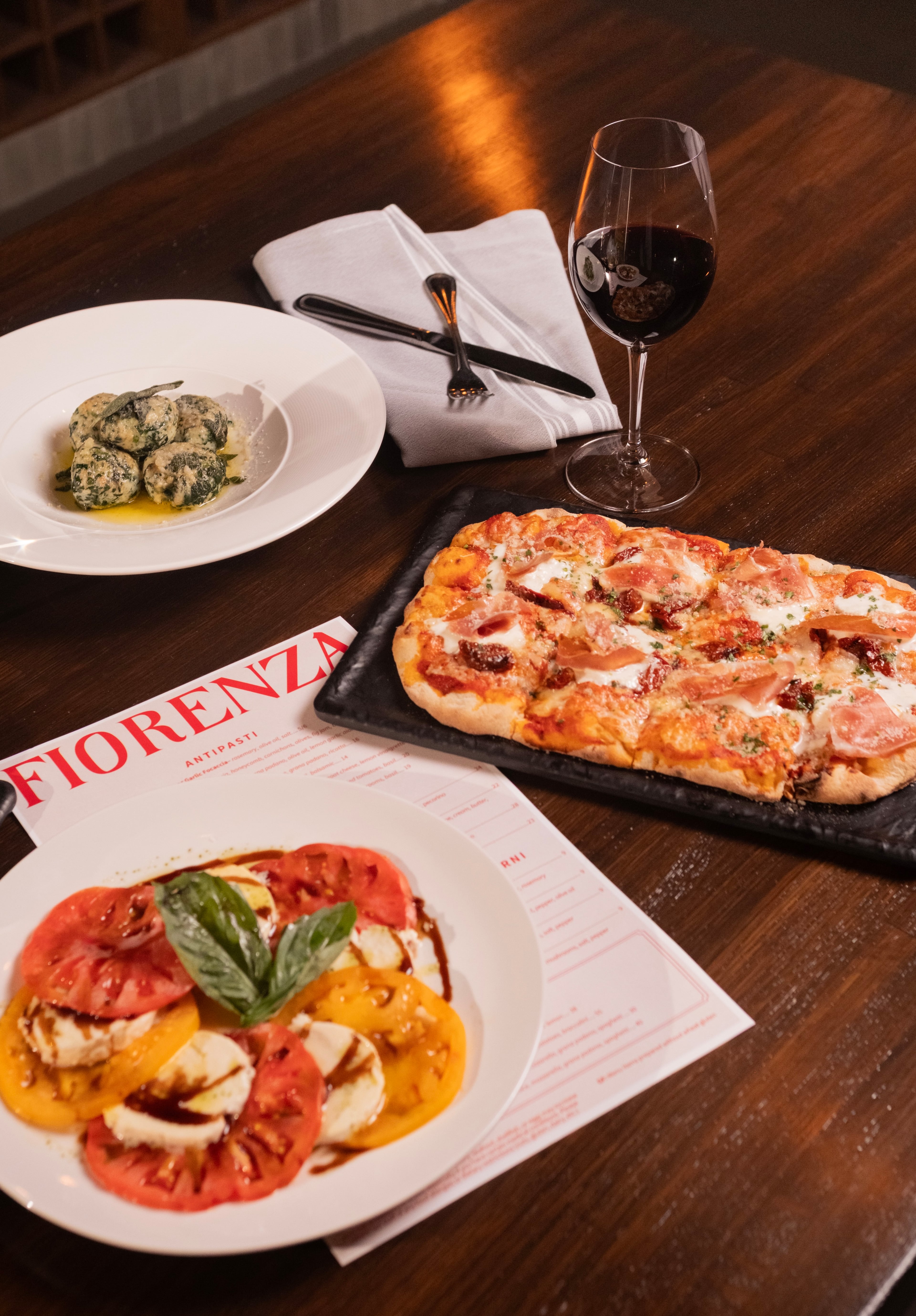 A selection of menu items from Fiorenza in Alpharetta, from front to back: caprese salad, pinsa and gnudi. (Jesus Ramirez Photography/Courtesy of Fiorenza)