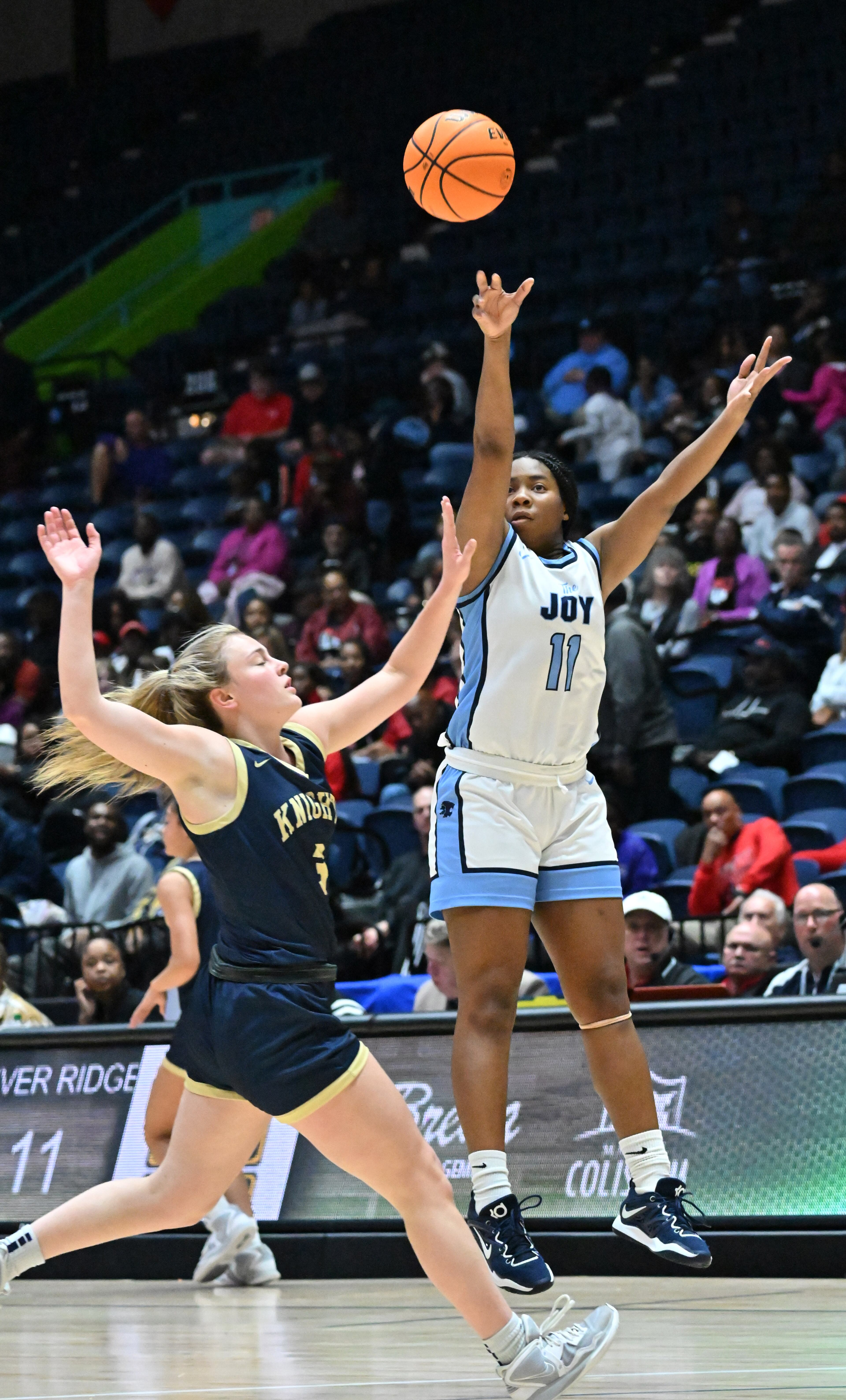 Lovejoy's Morgan Bone (11) shoots over River Ridge's Sophia Pearl (left) during the Class 6A girls state championship game Friday in Macon.