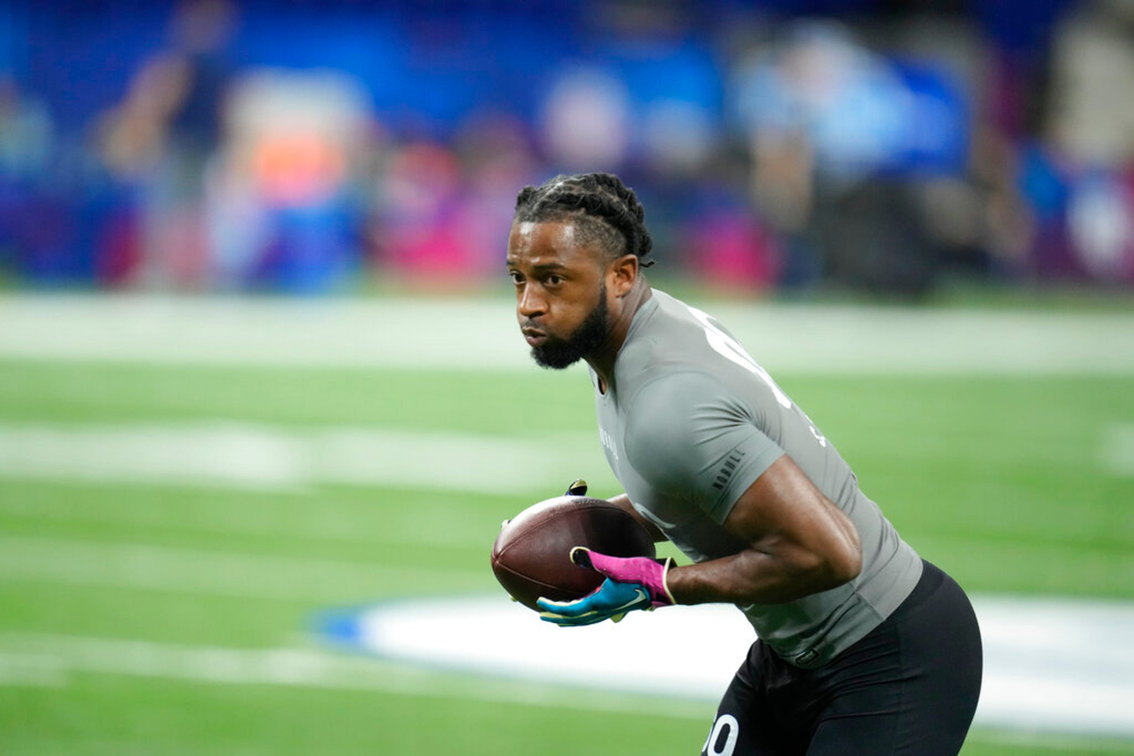 Georgia defensive back Christopher Smith II runs a drill at the NFL football scouting combine in Indianapolis, Friday, March 3, 2023. (AP Photo/Michael Conroy)