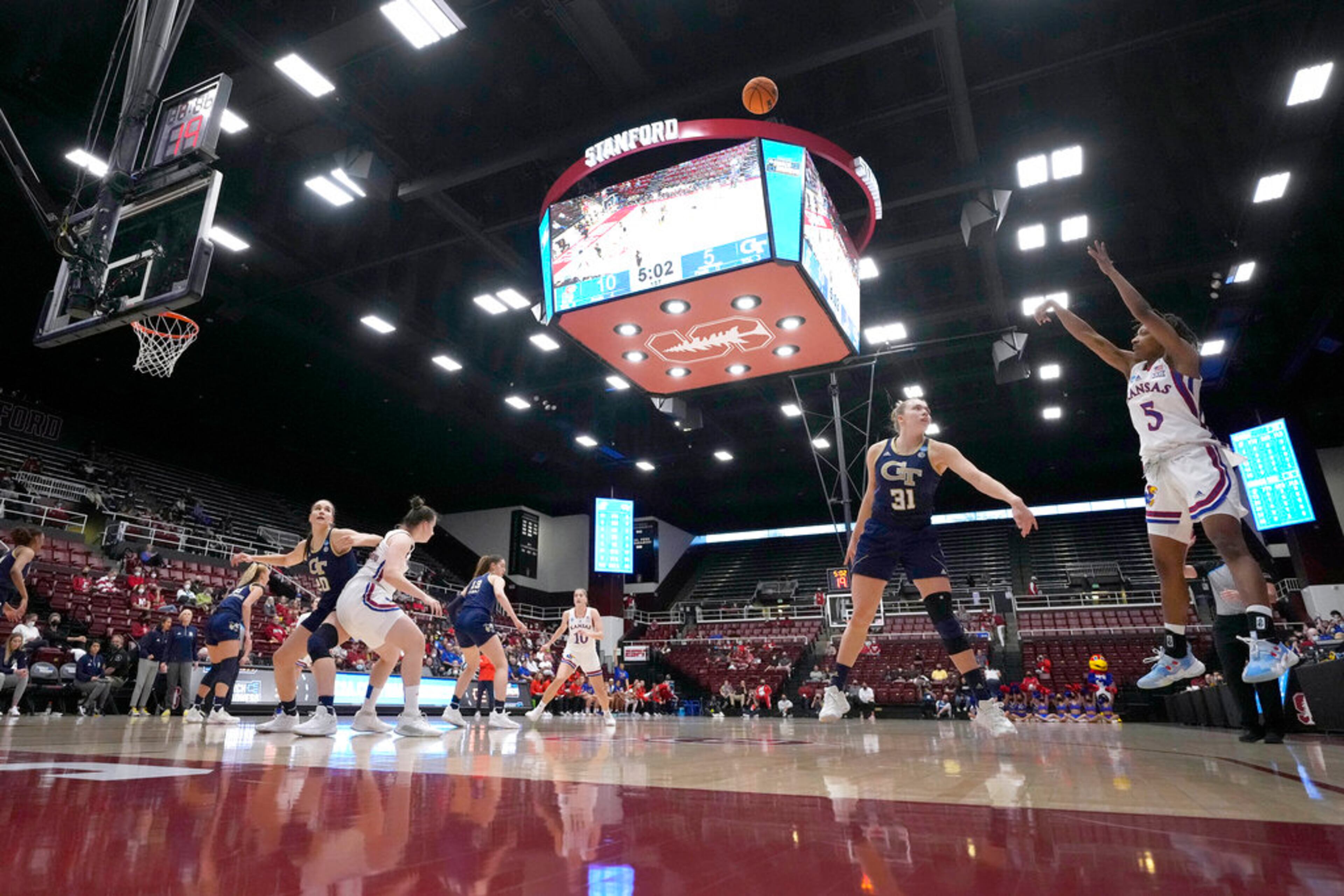 Kansas guard Aniya Thomas (5) shoots over Georgia Tech guard Lotta-Maj Lahtinen (31) during the first half of a first-round game in the NCAA women's college basketball tournament Friday, March 18, 2022, in Stanford, Calif. (AP Photo/Tony Avelar)