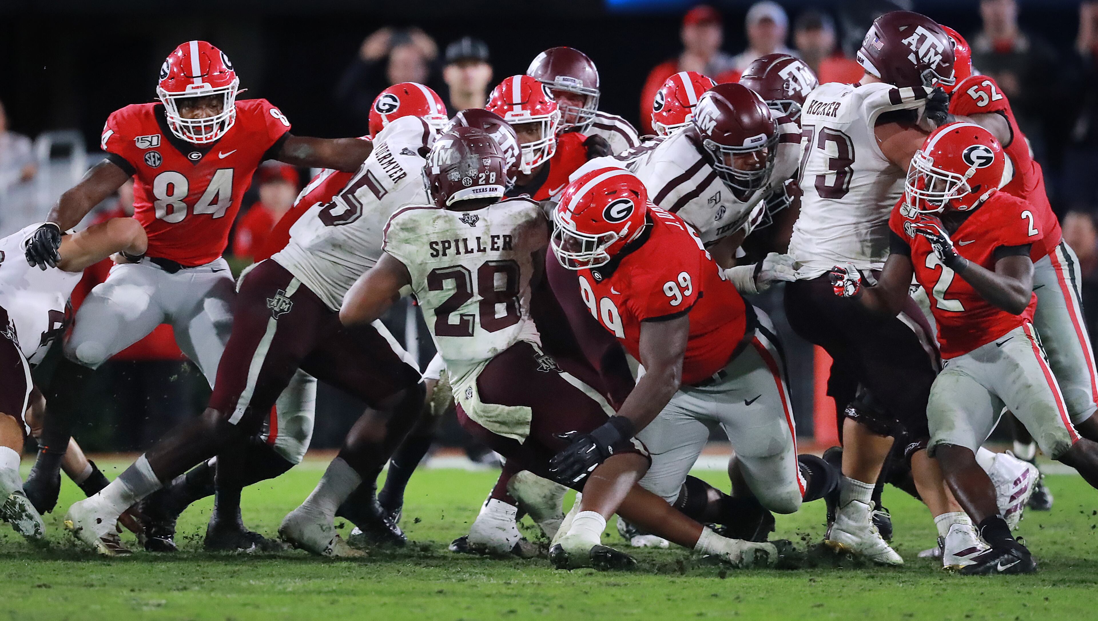Georgia defensive lineman (99) Jordan Davis tackles Texas A&M running back Isaiah Spiller at the line of scrimmage for no gain on a fourth down and one attempt to take over on downs during the third quarter on the way to a 19-13 victory in a NCAA college football game on Saturday, November 23, 2019, in Athens. Curtis Compton/ccompton@ajc.com