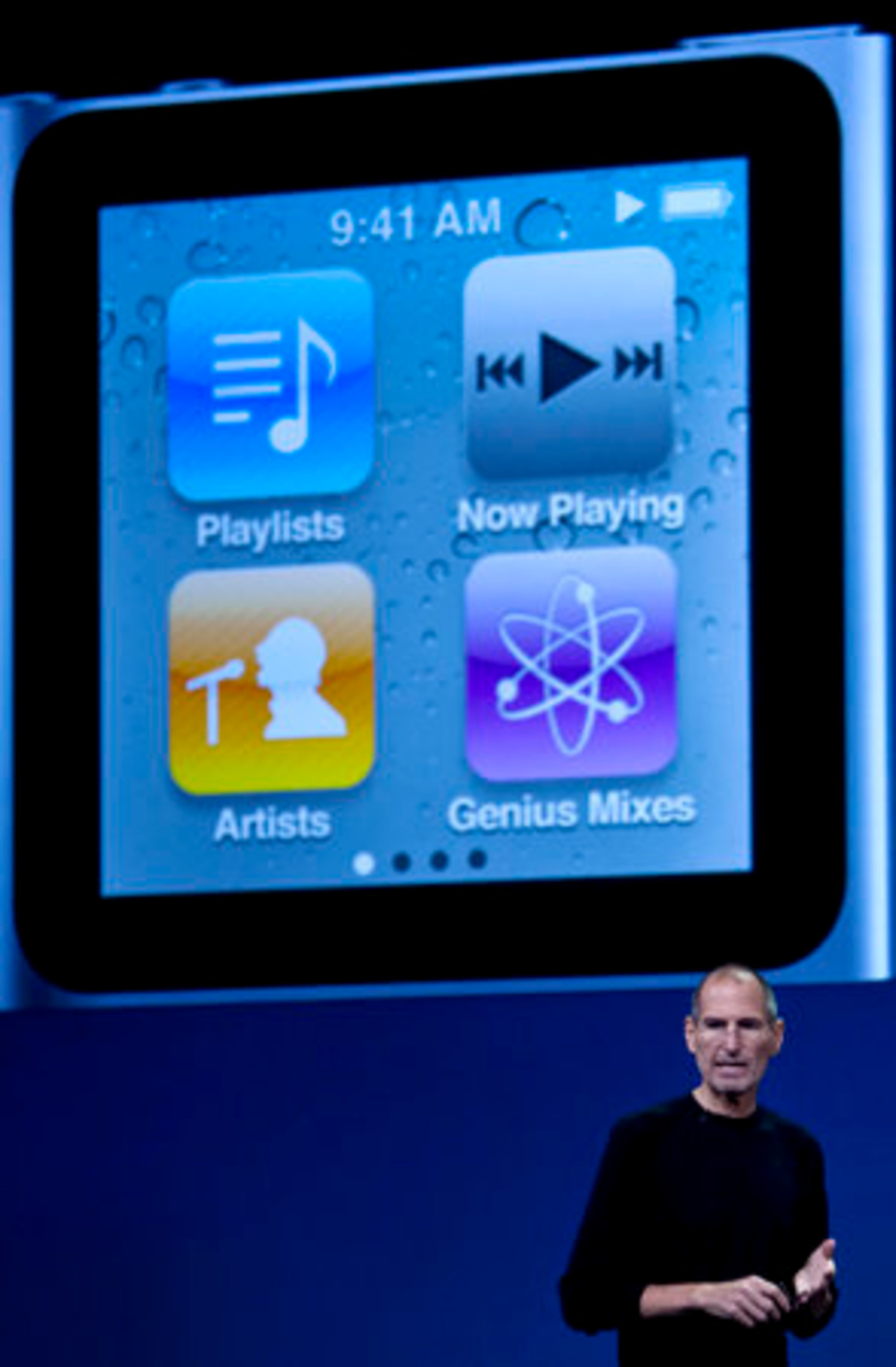 Steve Jobs, chief executive officer of Apple Inc., shows the touchscreen of the new Apple iPod Nano, unveiled in San Francisco on Wednesday. The company introduced new iPods, added a social networking feature to its iTunes software, and unveiled a new Apple TV set-top box that offers television and movie rentals.