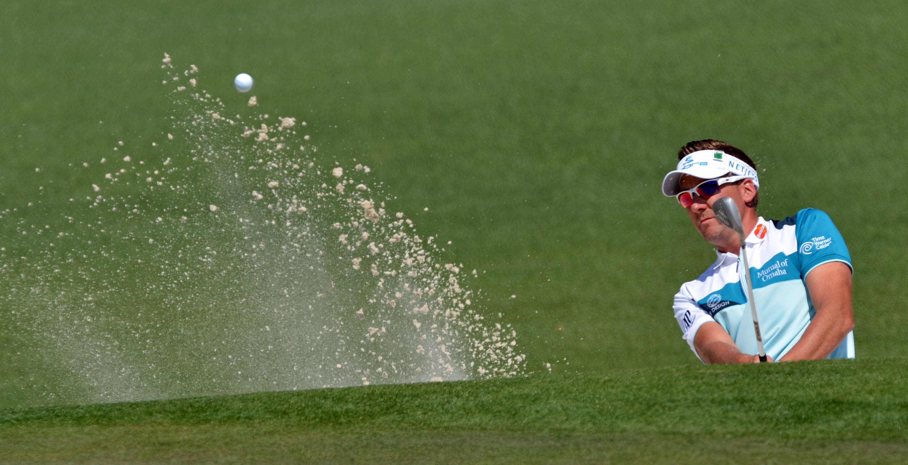 Ian Poulter hits from the bunker on #2 during the third round of the Masters Tournament Saturday, April 12, 2014, at Augusta National Golf Club.