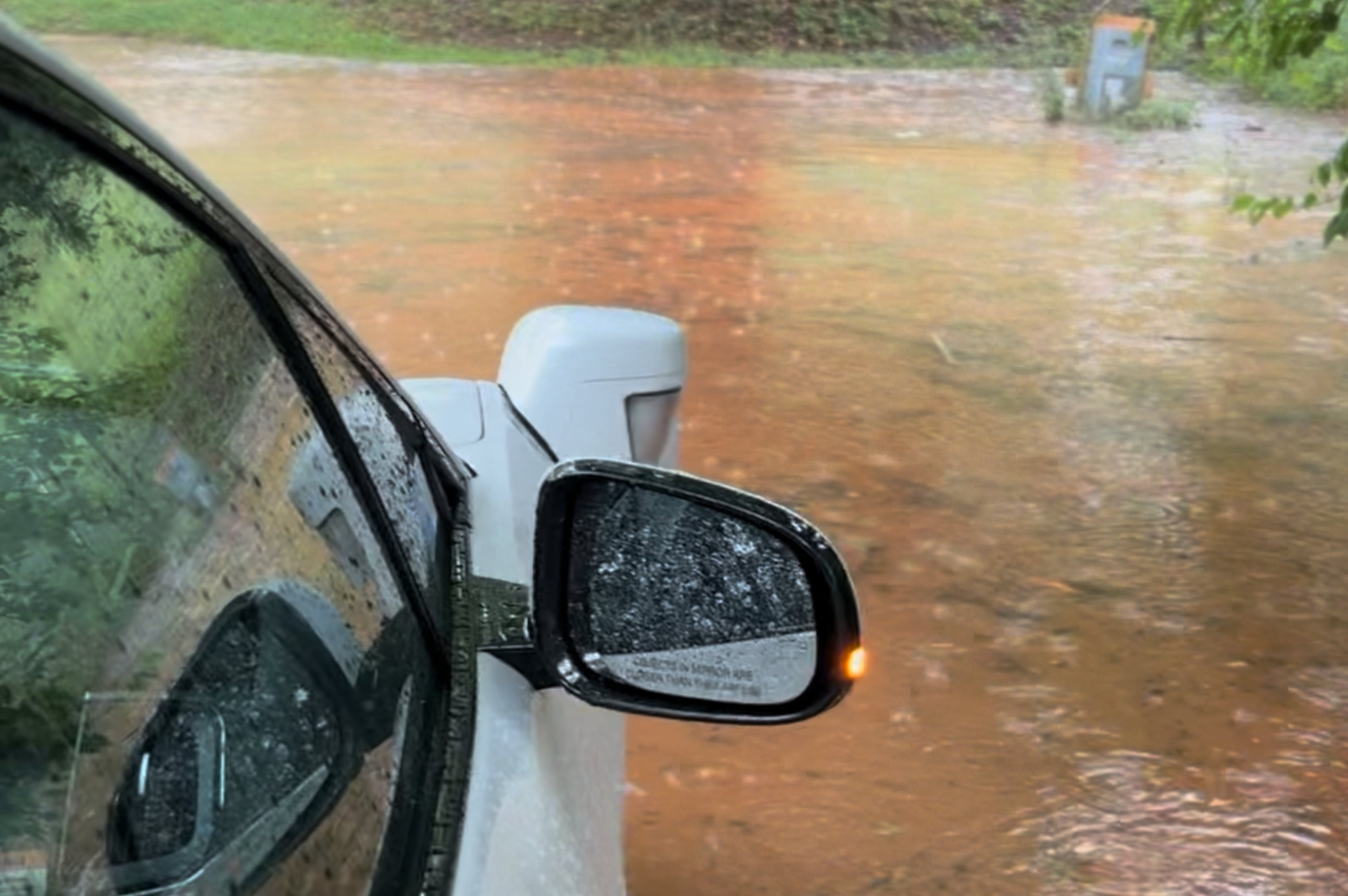 Waymo in flood water
