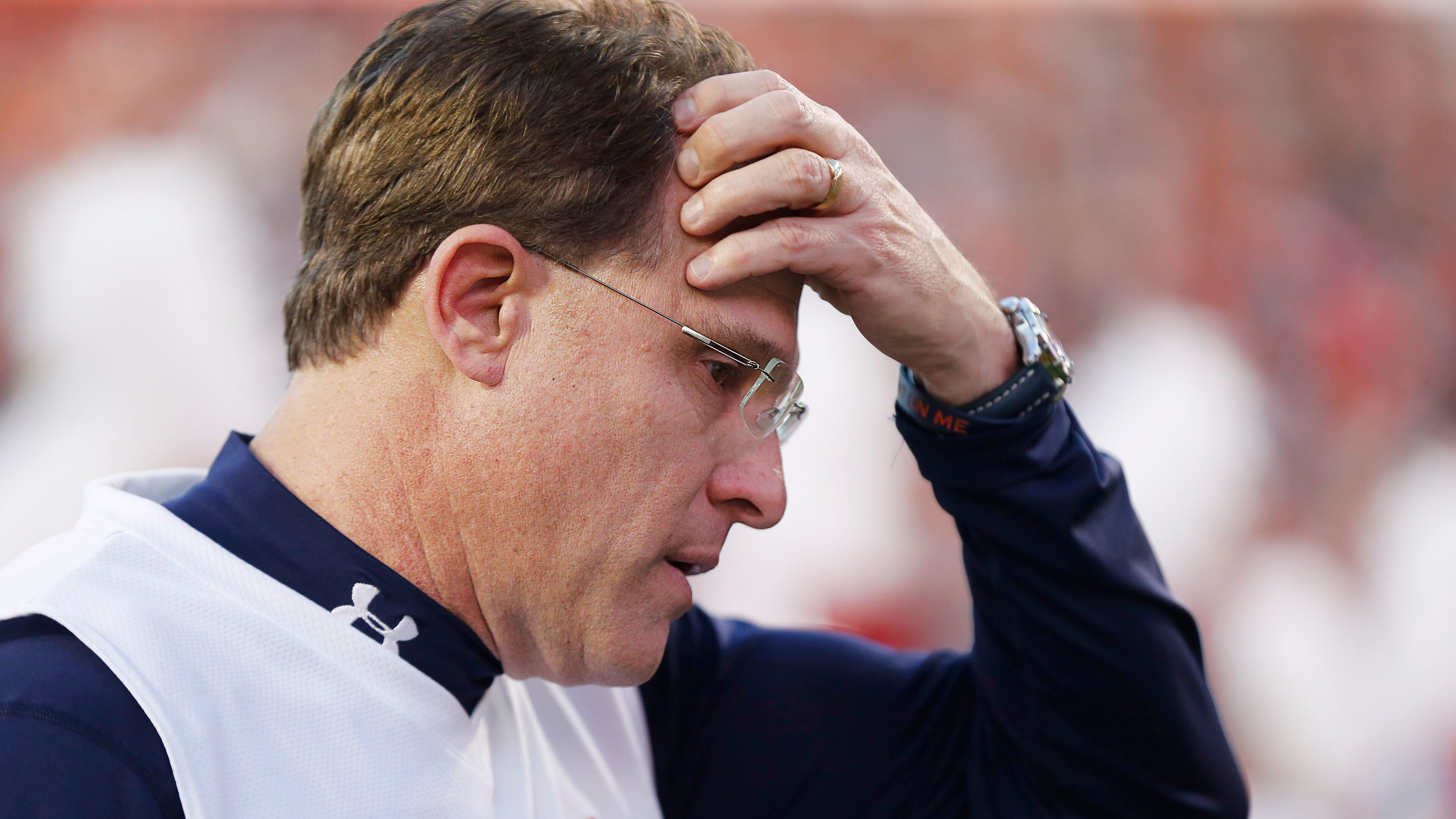 FILE - In this Nov. 28, 2015 file photo, Auburn head coach Gus Malzahn walks off the field with his head down in the first half during an NCAA college football game against Alabama, in Auburn, Ala. Malzahn's tasks leading up to the Birmingham Bowl against Memphis include replacing Will Muschamp as defensive coordinator and secondary coach Travaris Robinson, who went with the new South Carolina head man. (AP Photo/Gerald Herbert, File)