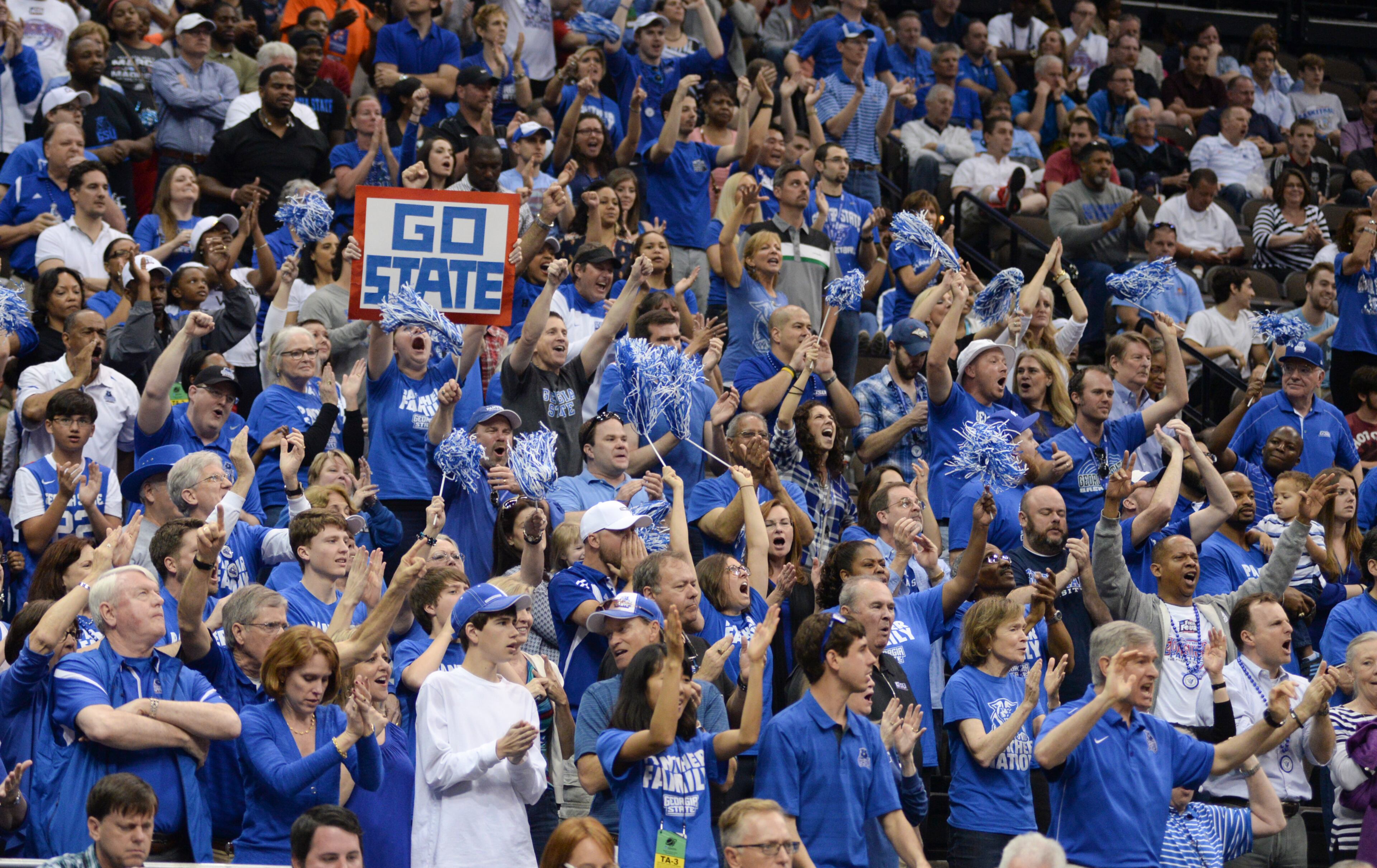 Georgia State fans cheer during the first half of an NCAA tournament third round college basketball game against Xavier , Saturday, March 21, 2015, in Jacksonville, Fla. (AP Photo/Rick Wilson)