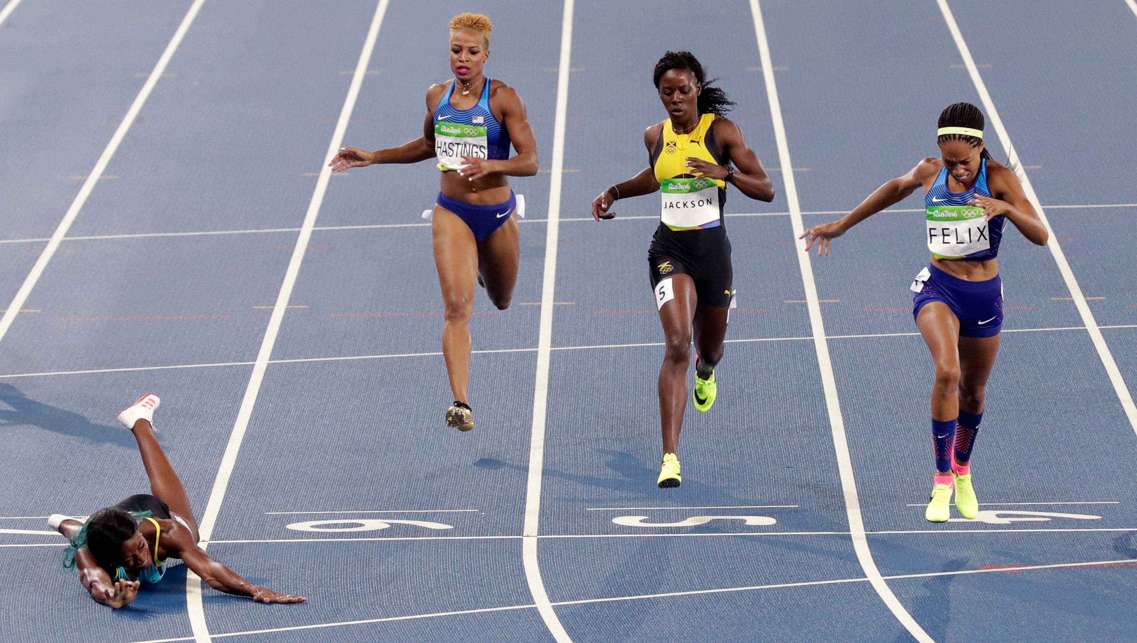 Bahamas' Shaunae Miller, left, beats United States' Allyson Felix, second right, to win the women's 400-meter final during the athletics competitions of the 2016 Summer Olympics at the Olympic stadium in Rio de Janeiro, Brazil, Monday, Aug. 15, 2016. (AP Photo/Martin Meissner)