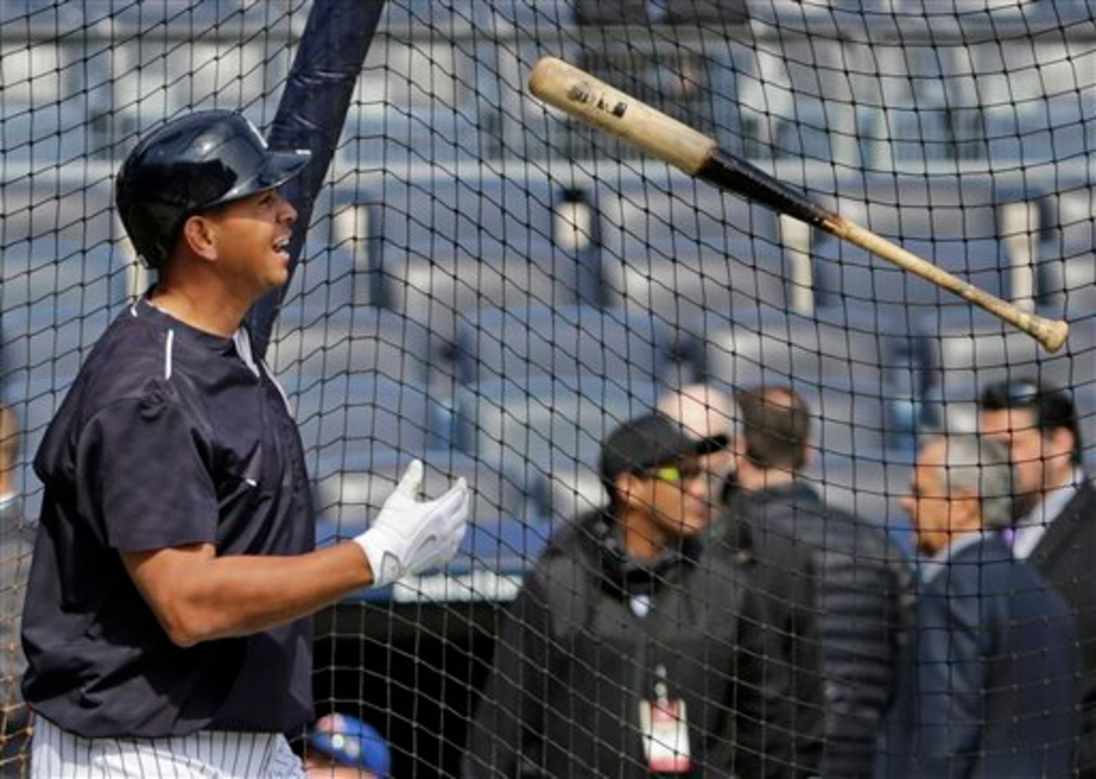 New York Yankees designated hitter Alex Rodriguez (13) tosses his bat after taking batting practice before an opening day baseball game against the Toronto Blue Jays in New York, Monday, April 6, 2015. (AP Photo/Kathy Willens)