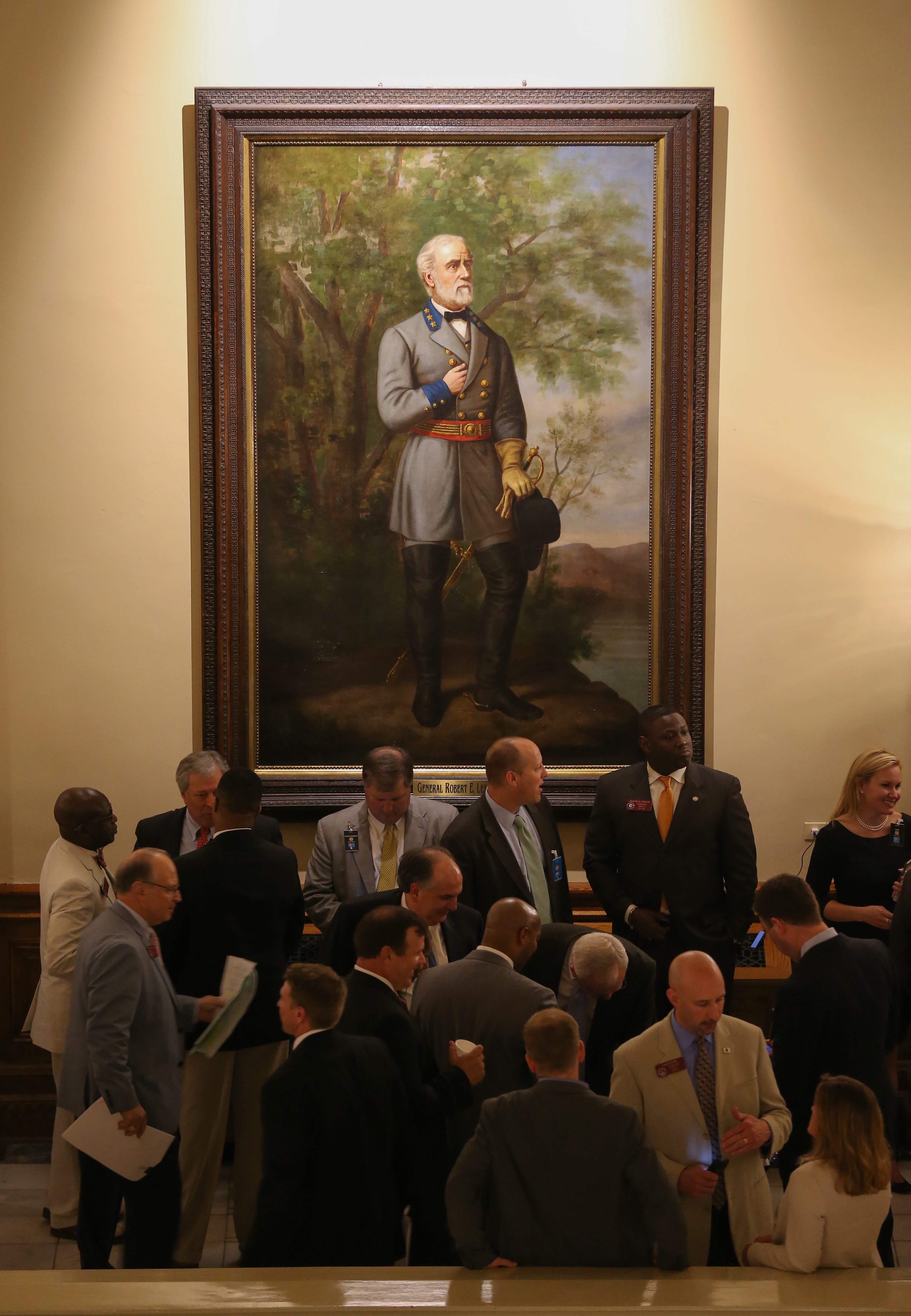 March 24, 2016 Atlanta: Lobbyists and legislators mingle under a portrait of Gen. Robert E. Lee outside of the House chamber on the last night of the 2016 Legislative session Thursday March 24, 2016. Ben Gray / bgray@ajc.com