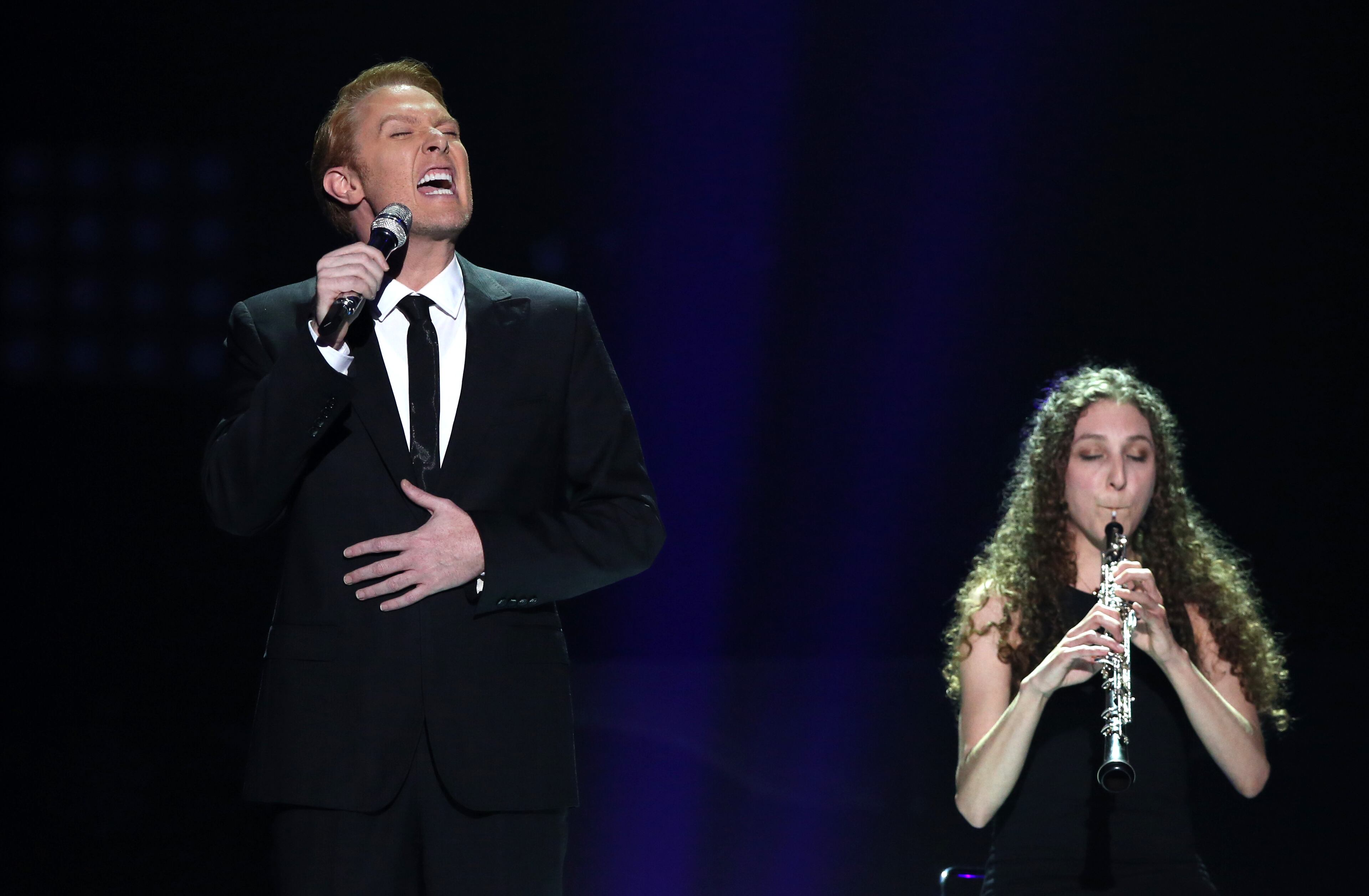 Clay Aiken, left, performs at the "American Idol" farewell season finale at the Dolby Theatre on Thursday, April 7, 2016, in Los Angeles. (Photo by Matt Sayles/Invision/AP)