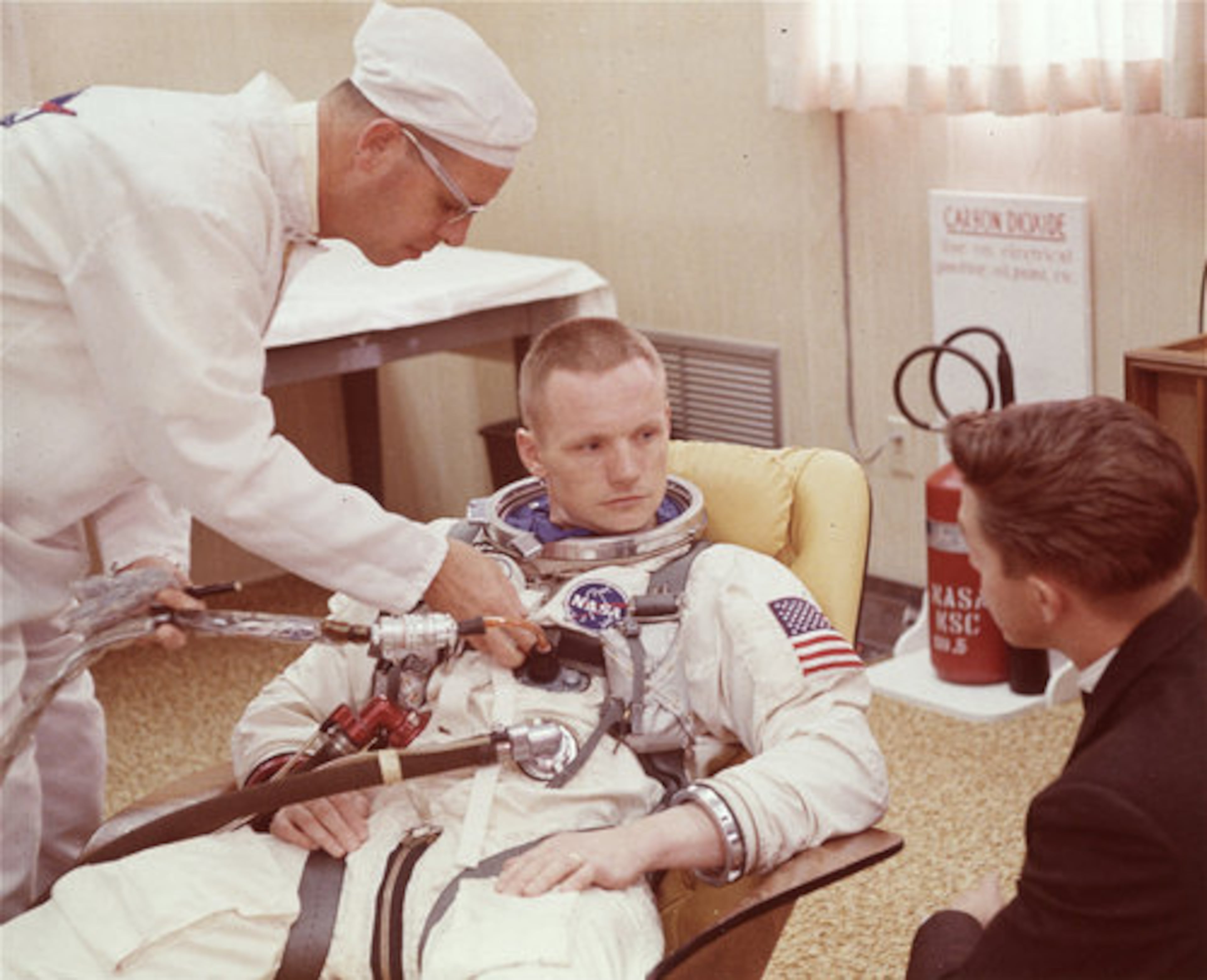 In this March 9, 1966 photo, Astronaut Neil Armstrong is seated during a suiting up exercise Cape Kennedy, Florida, in preparation for the Gemini 8 flight.