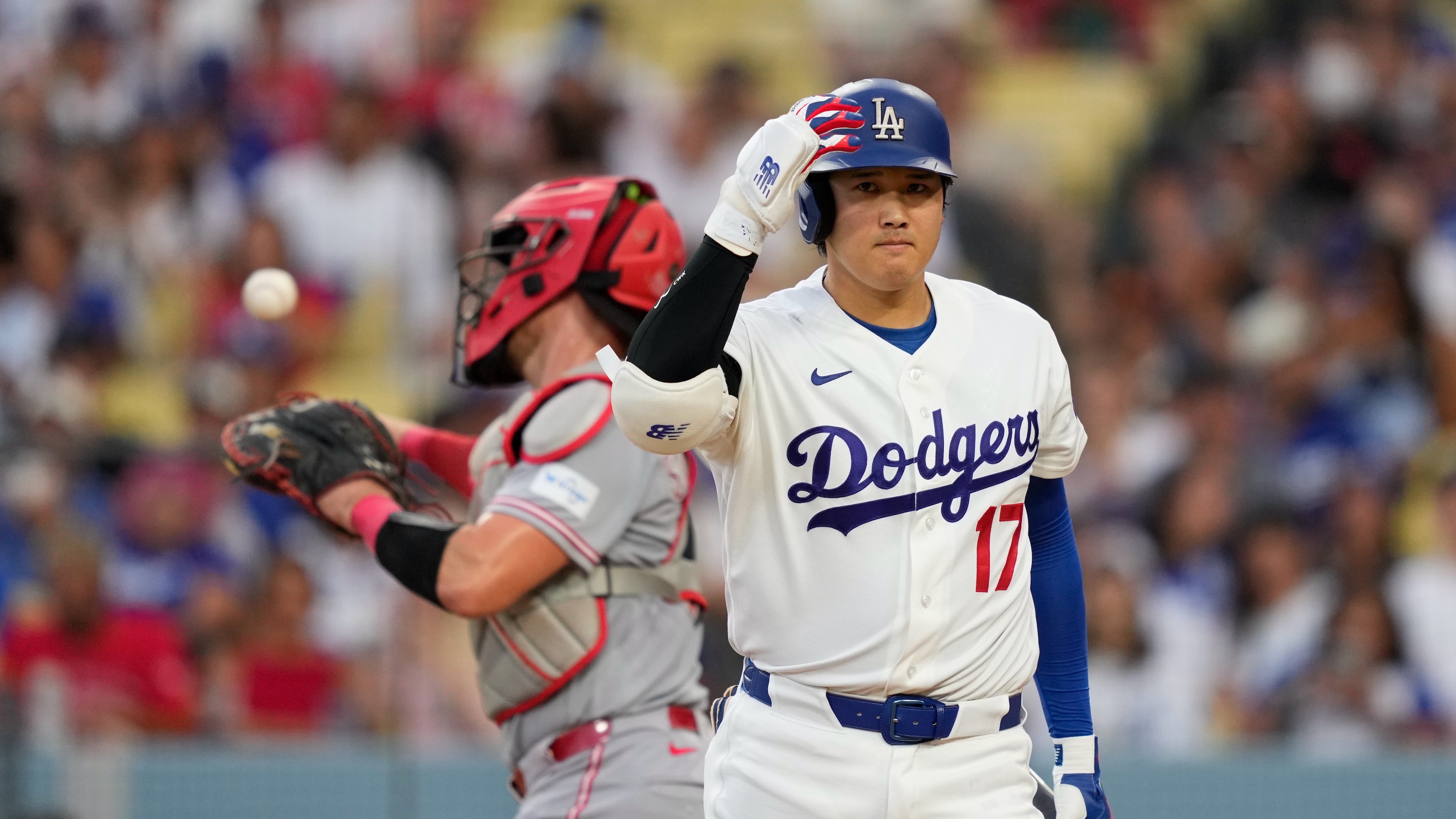 Los Angeles Dodgers' Shohei Ohtani, right, walks back to the dugout after striking out as Cincinnati Reds catcher Tyler Stephenson throws the ball back during the third inning of a baseball game Monday, Sept. 7, 2026, in Los Angeles. (AP Photo/Mark J. Terrill)