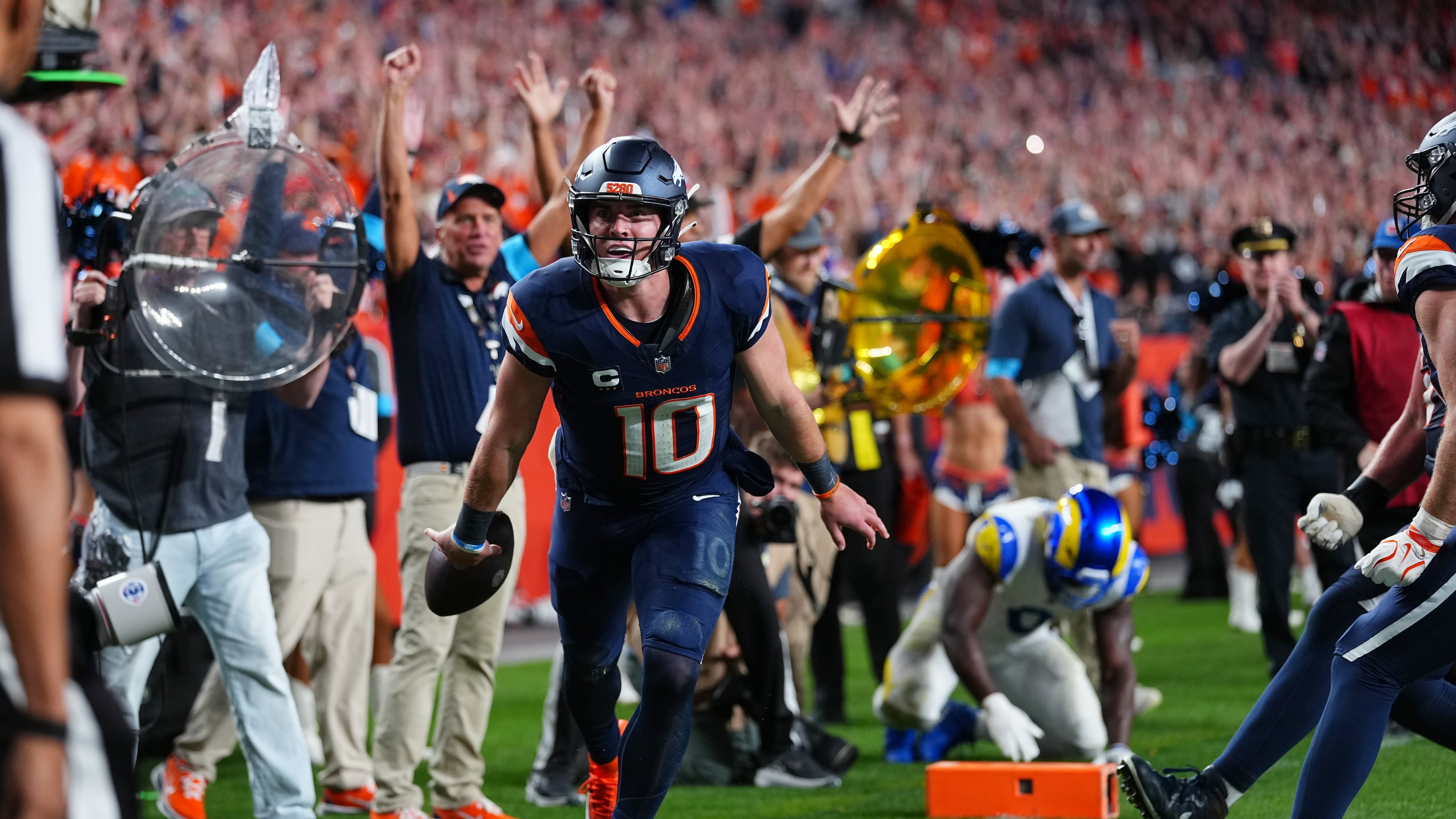 Denver Broncos quarterback Bo Nix reacts after a play against the Los Angeles Rams during the second half of an NFL football game Sunday, Sept. 27, 2026, in Denver. (AP Photo/Jack Dempsey)