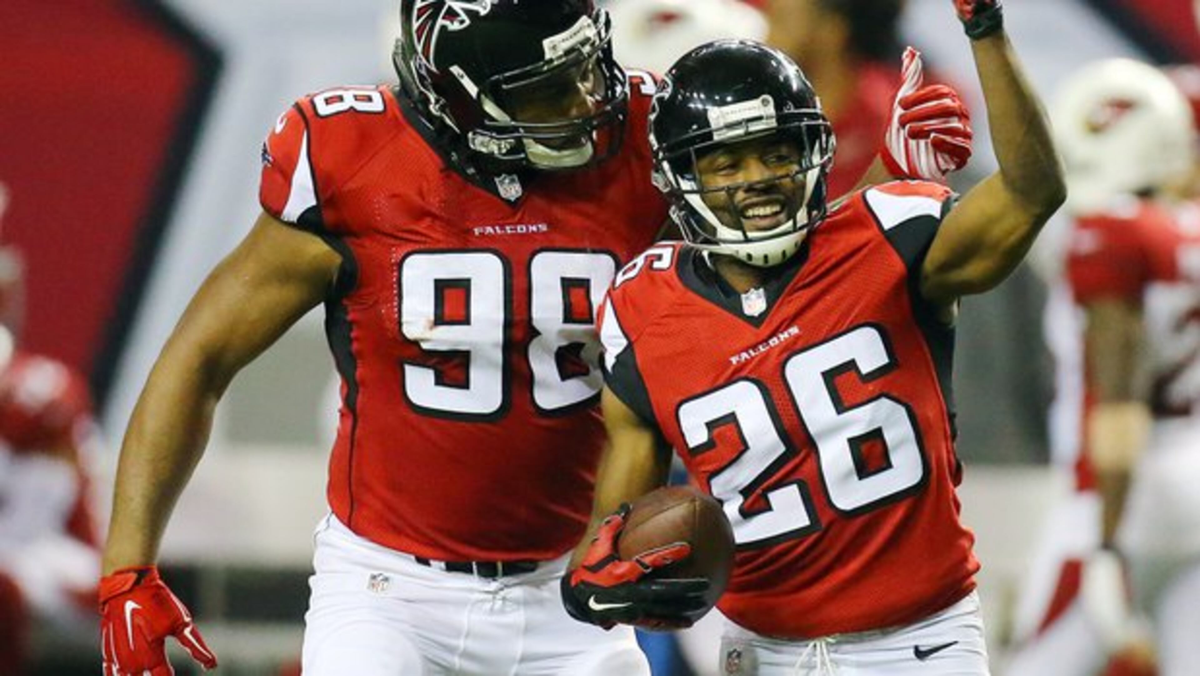 alcons cornerback Josh Wilson, right, celebrates intercepting Cardinals Drew Stanton with teammate Cliff Matthews during the second half in an NFL football game on Sunday, Nov. 30, 2014, in Atlanta. The Falcons beat the Cardinals 29-18. (AP Photo/Atlanta Journal-Constitution, Curtis Compton)