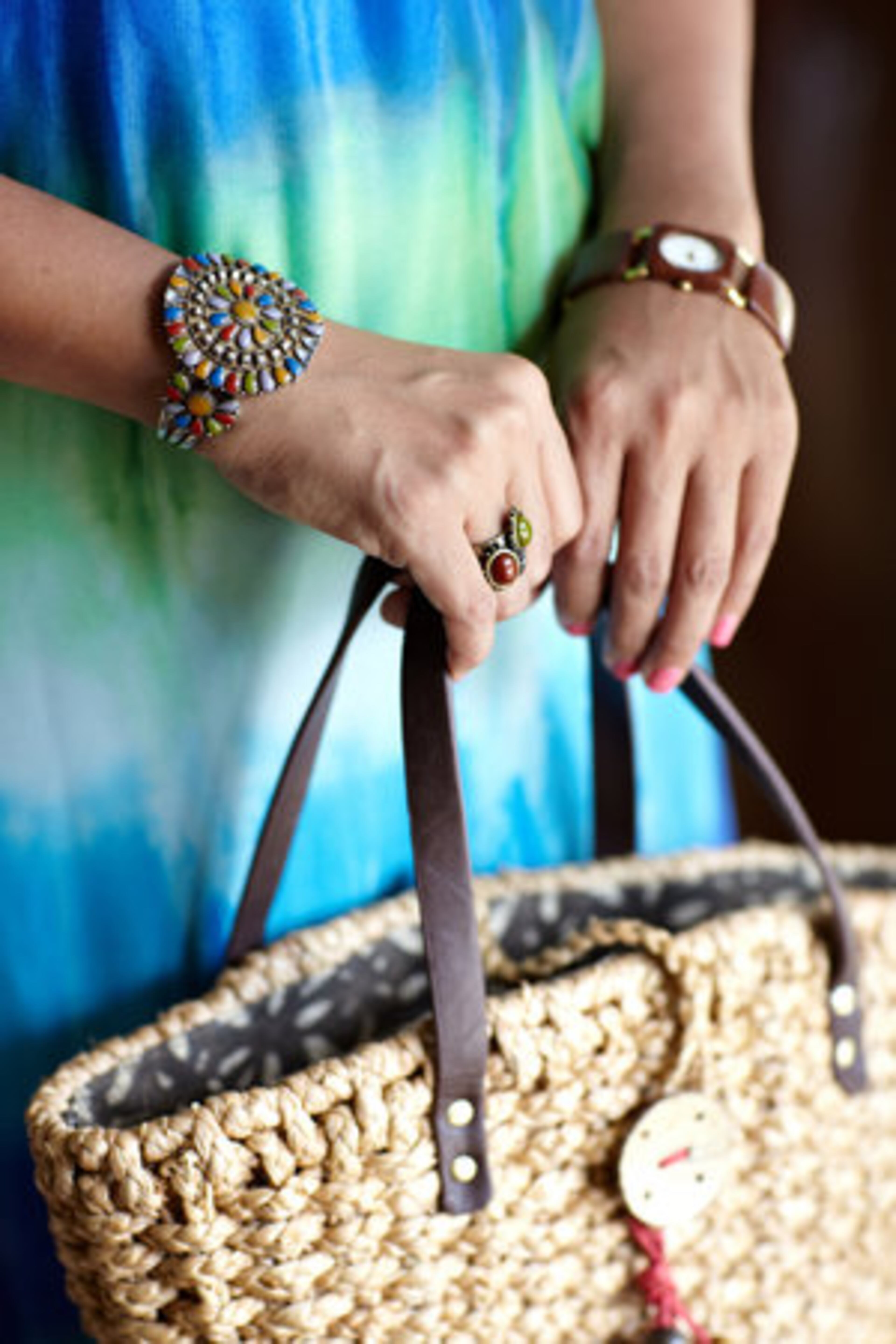 Lakhe accessorizes her Dillard's dress with an antique stone bracelet from Jaipur, India, a two stone ring from Charlotte Russe and a basket weave tote from Coldwater Creek.