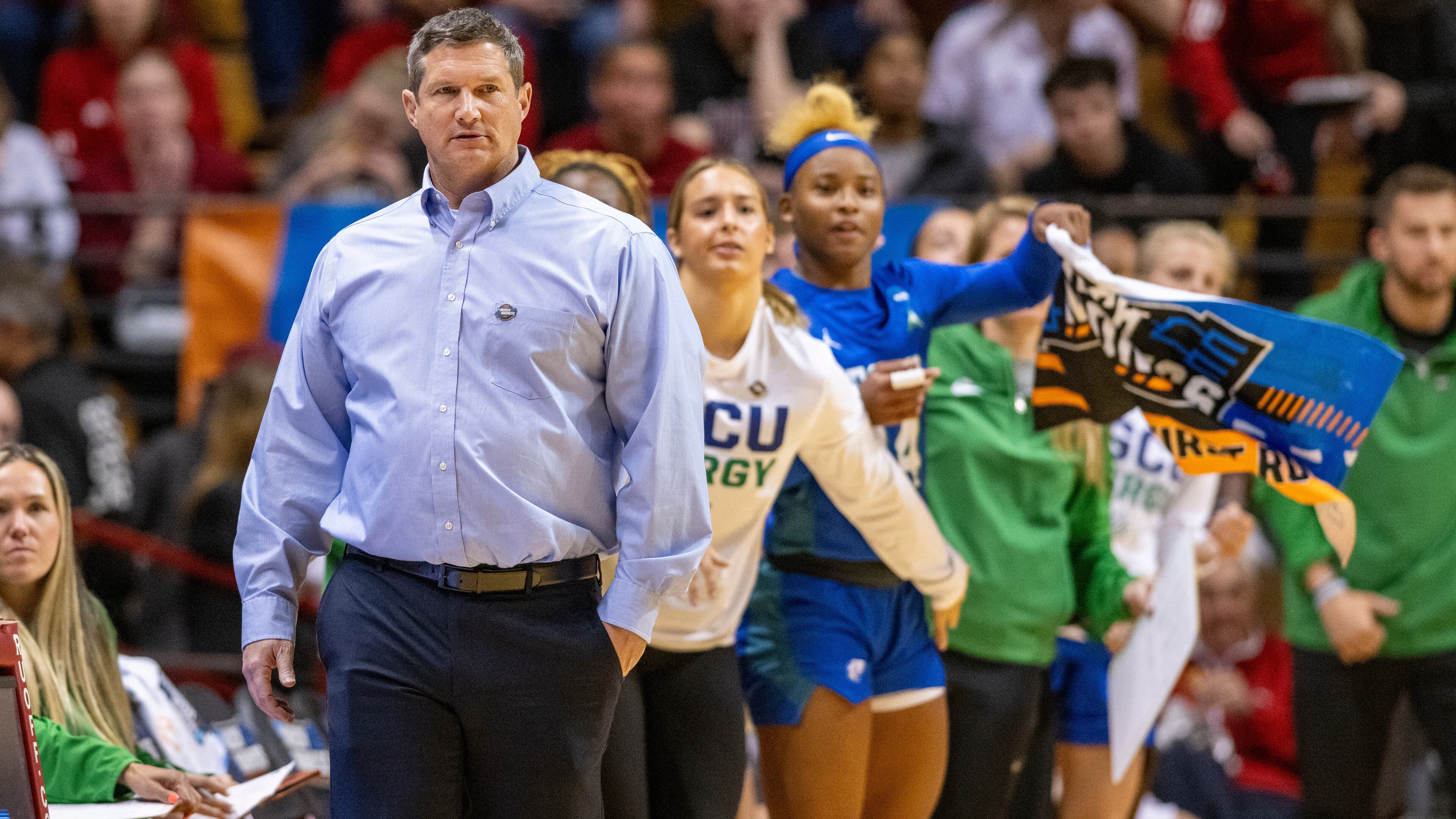 Florida Gulf Coast head coach Karl Smesko watches play on the court during a first-round college basketball game against Oklahoma in the NCAA Tournament, Saturday, March 23, 2024, in Bloomington, Ind. (AP Photo/Doug McSchooler)